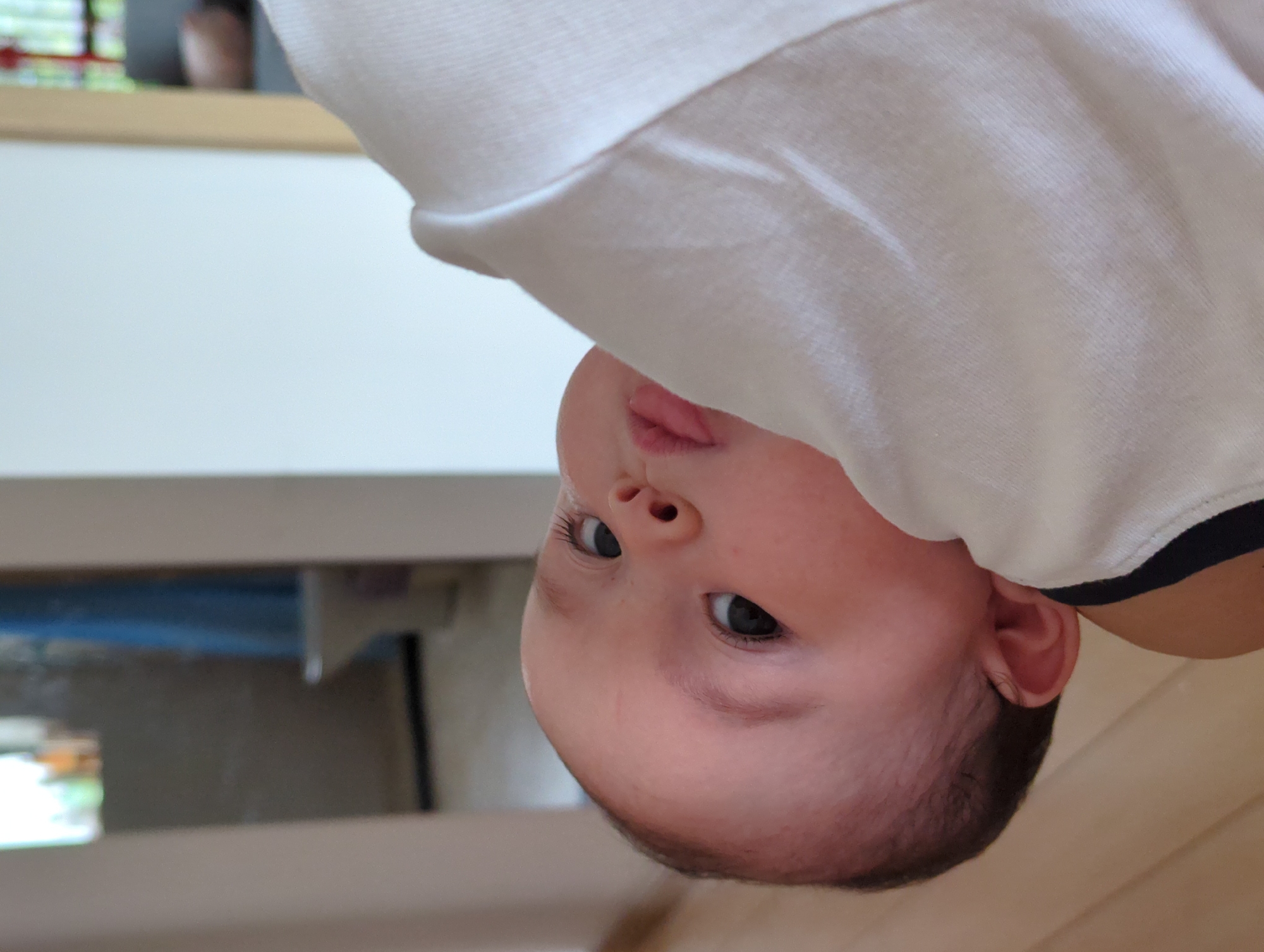 Baby observed suspended upside down indoors in Shunde District