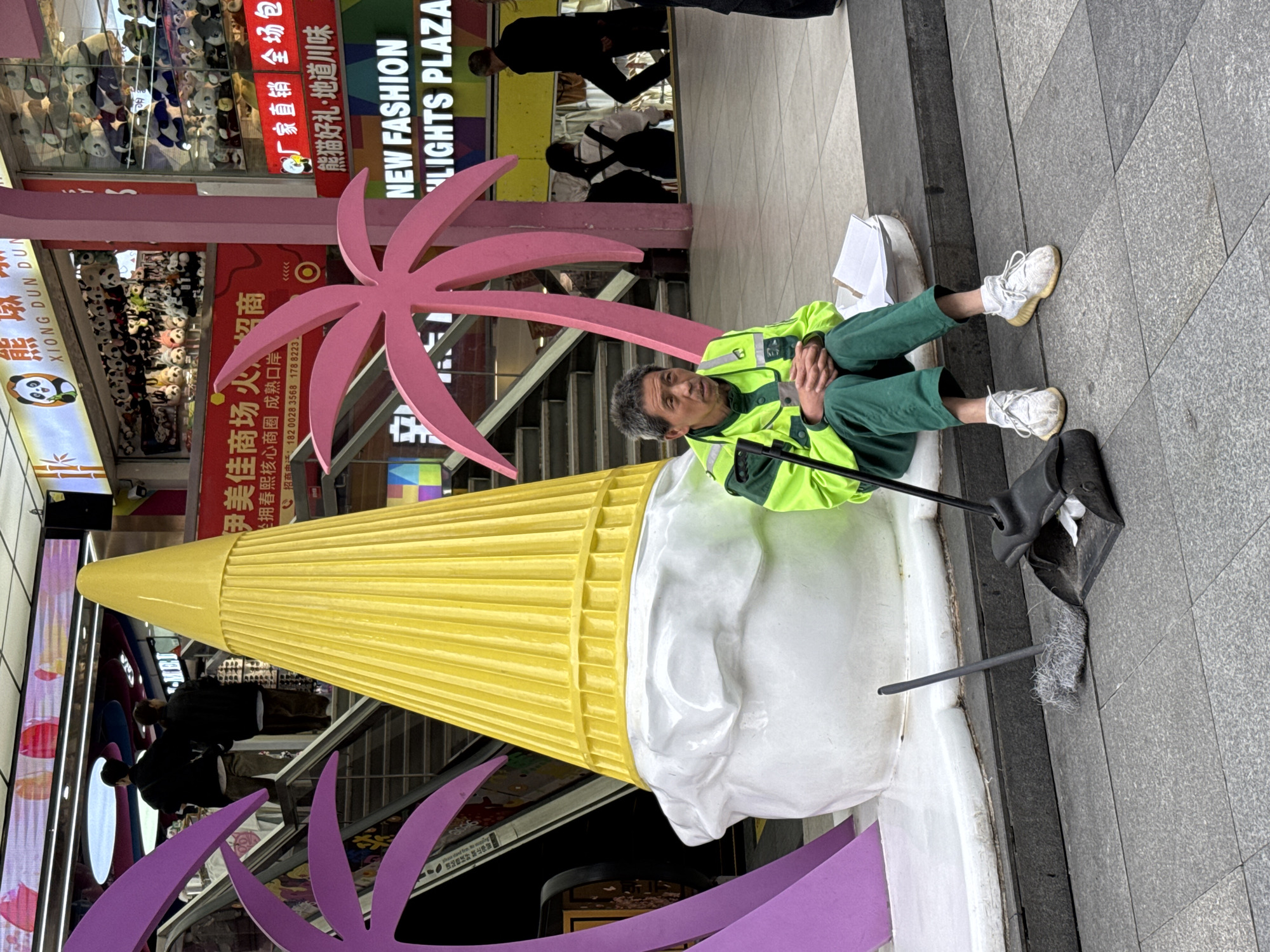 Scooter rider in yellow gear spotted on Jinjiang sidewalk