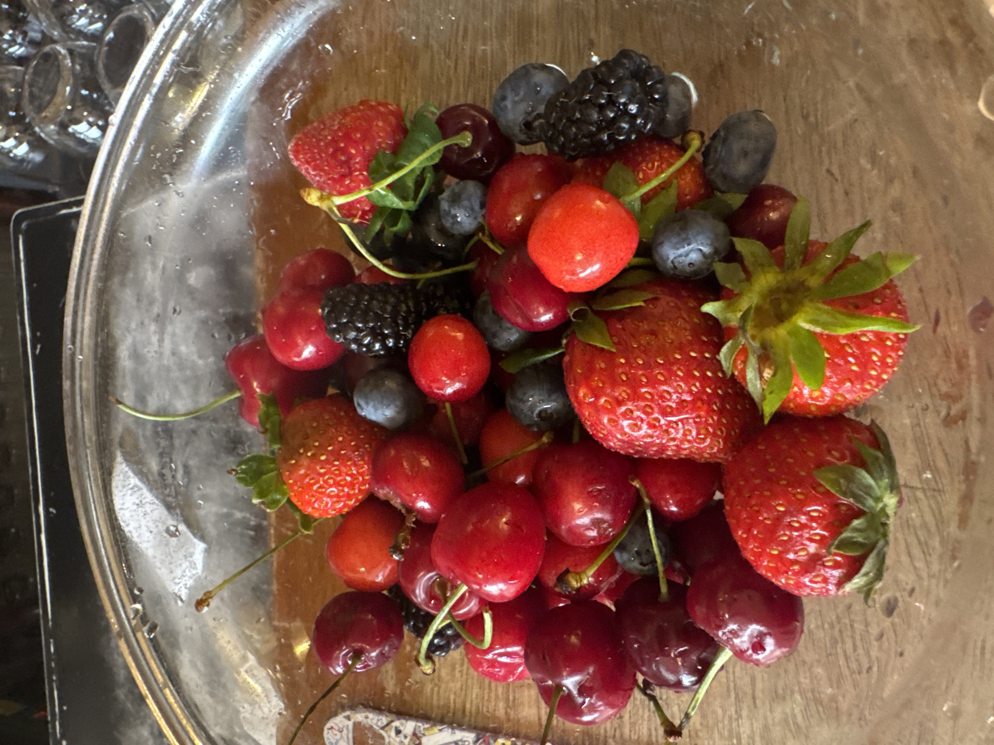 Person carries berry bowl near Sofia escalators Monday morning