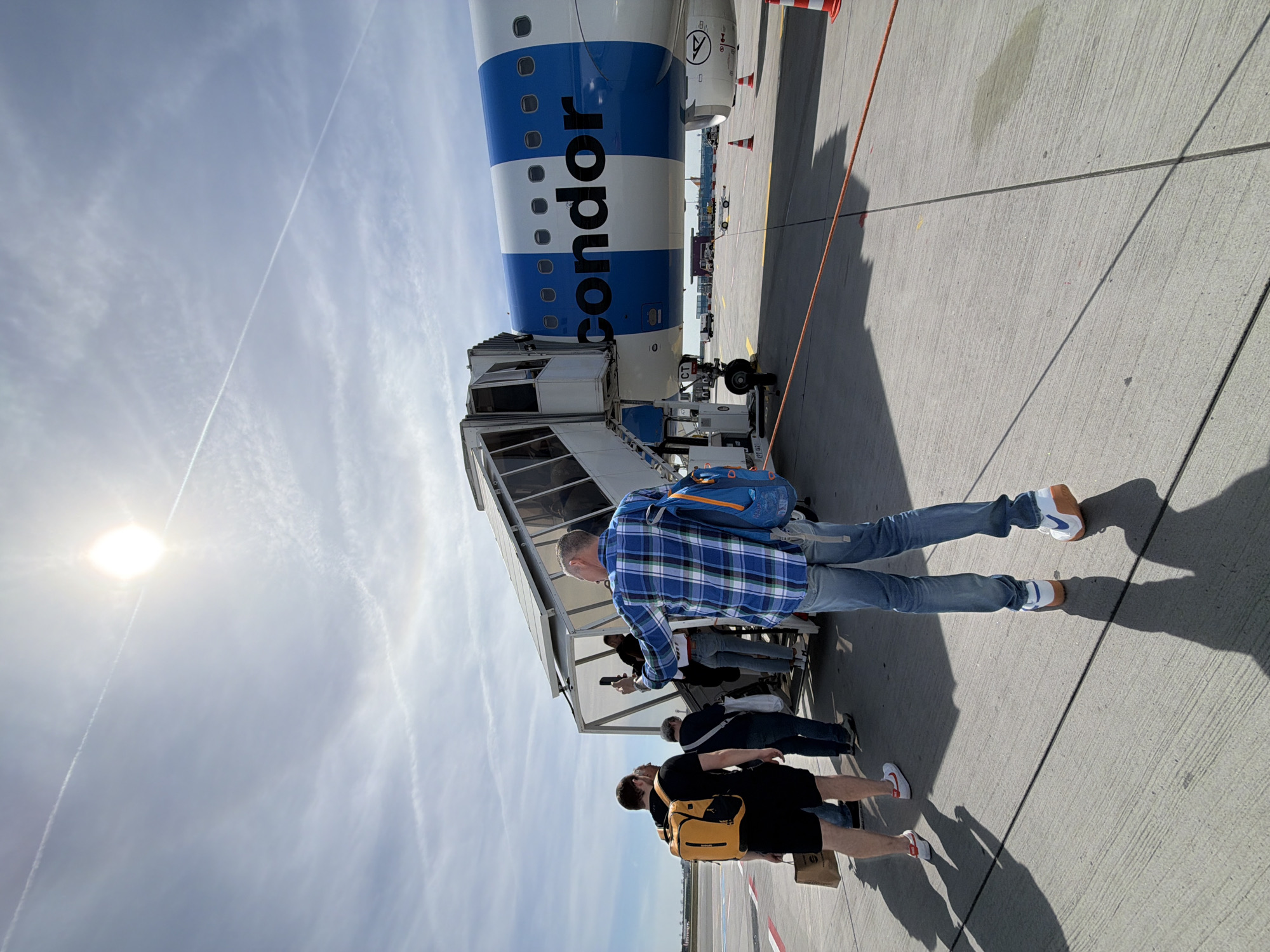 Condor Airlines passengers board, disembark at Frankfurt Airport