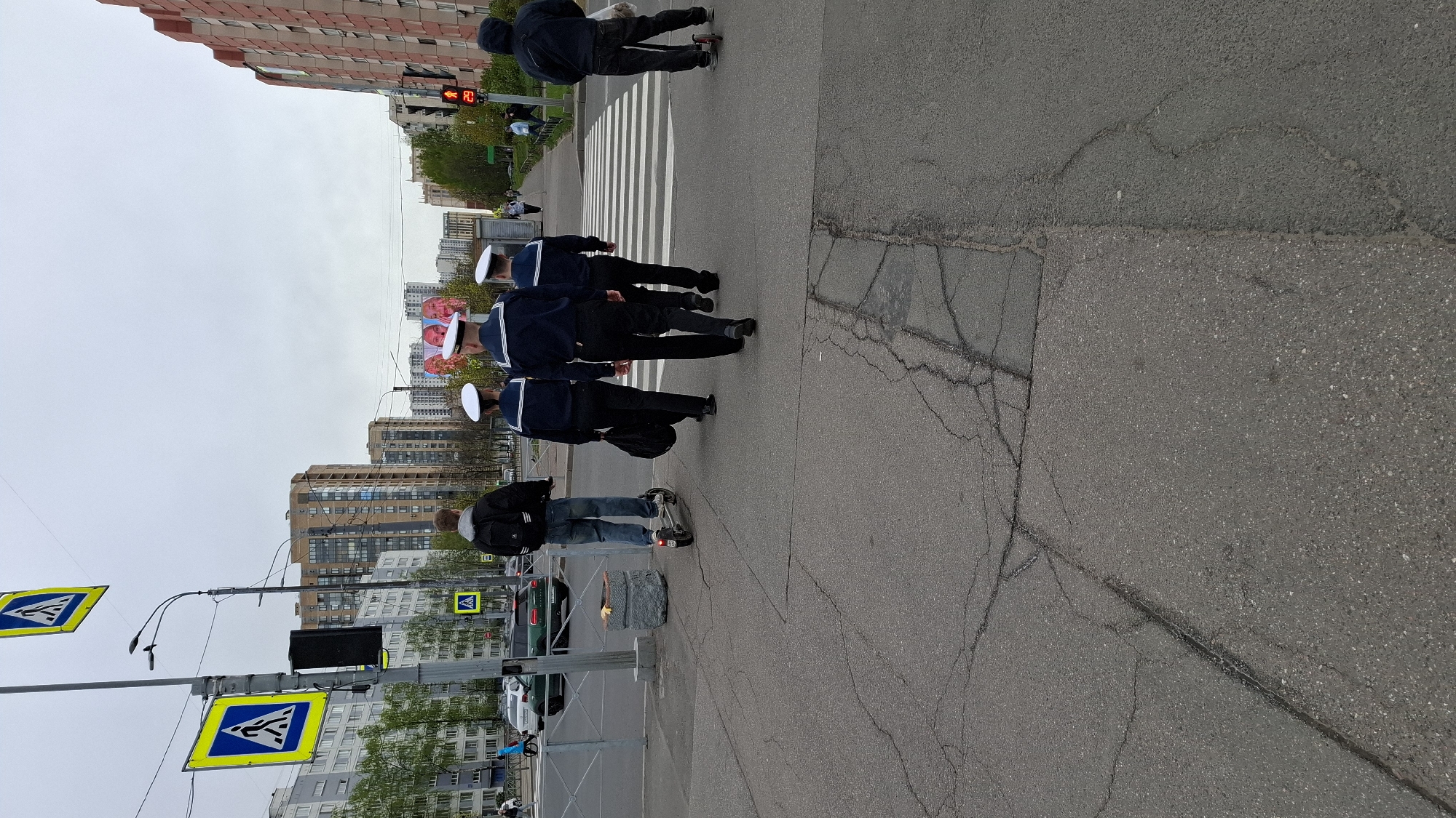 Sailors cross street near church in Saint Petersburg