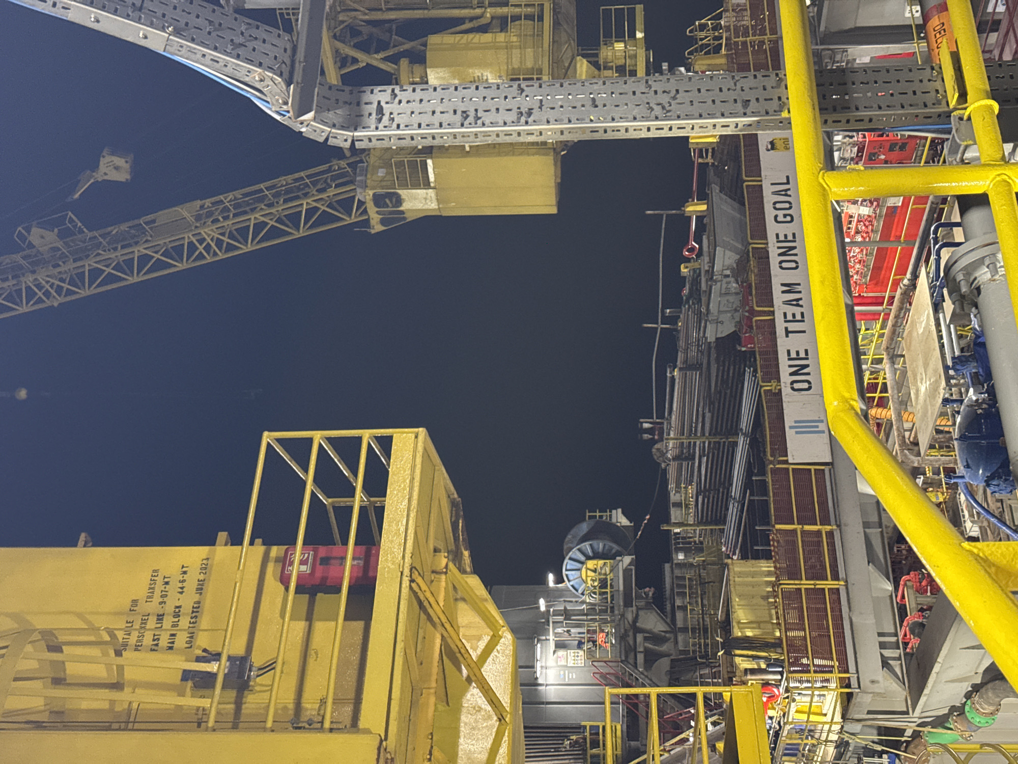 Offshore oil rig operations documented near Italy at night