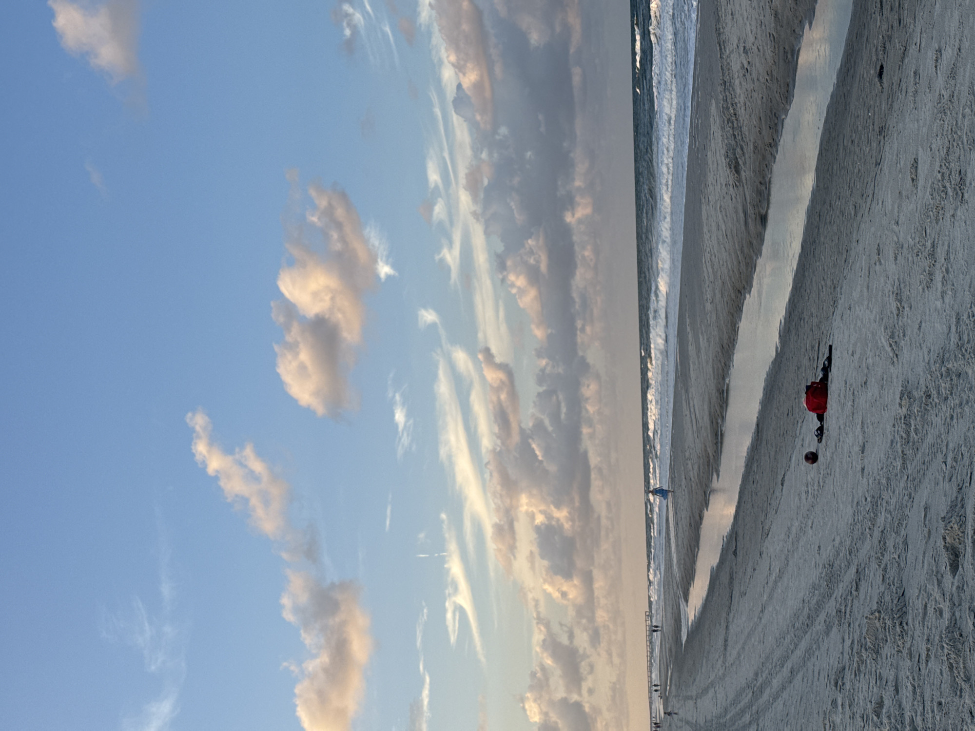 Jacksonville Beach at dusk, rope barriers and tire tracks in the sand