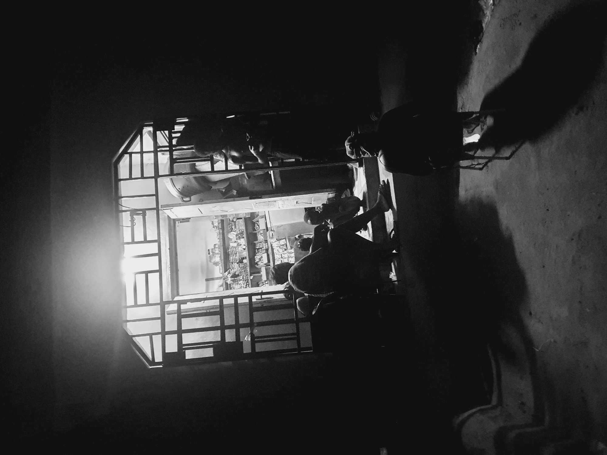 Evening activity captured at Lokoja shop through security grating