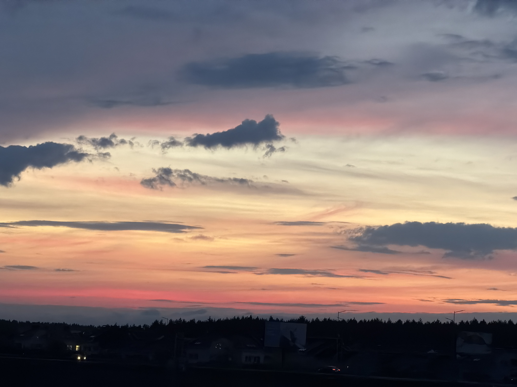 Twilight scenes documented in rural Belarus village during evening hours