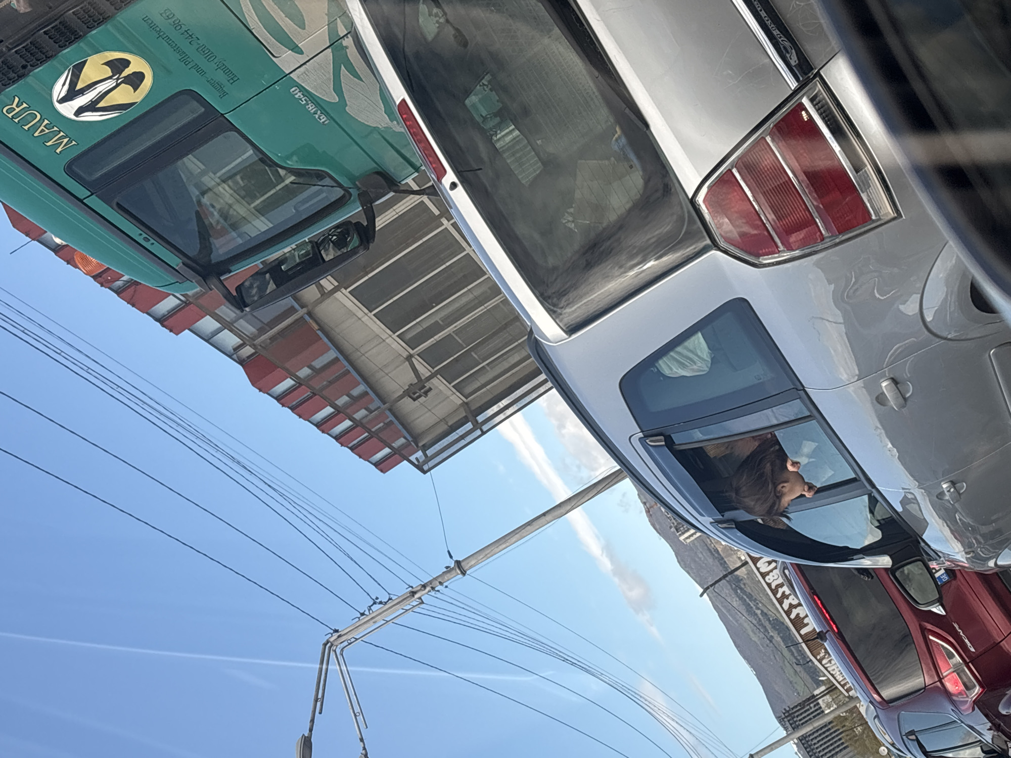 Morning traffic and parked vehicles observed in Tbilisi streets