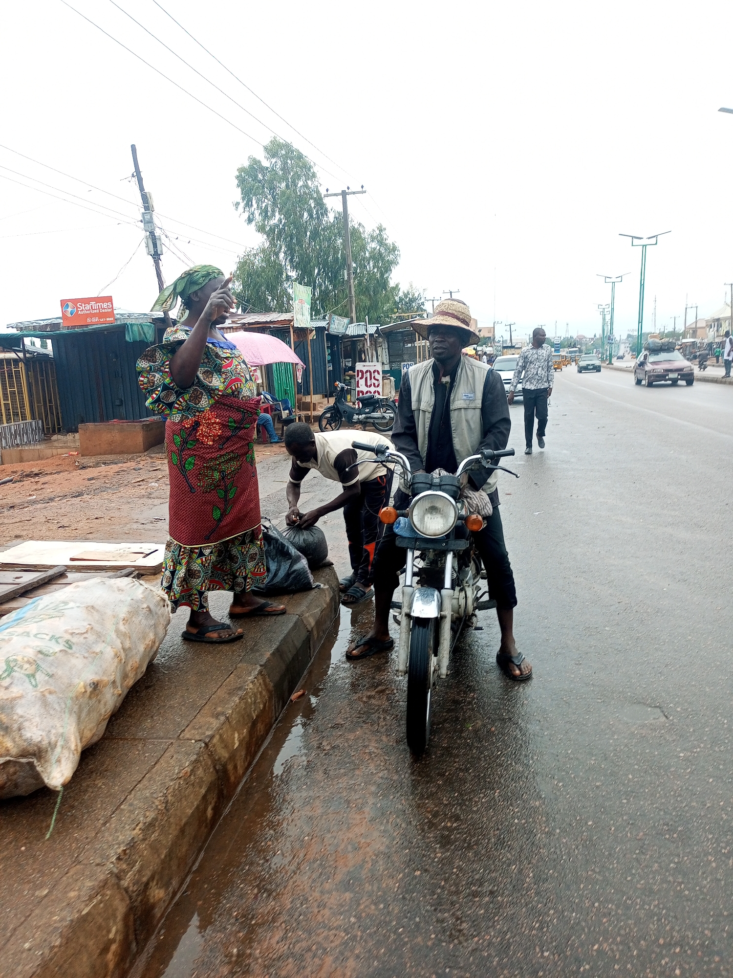 Wet morning street scenes show daily market life
