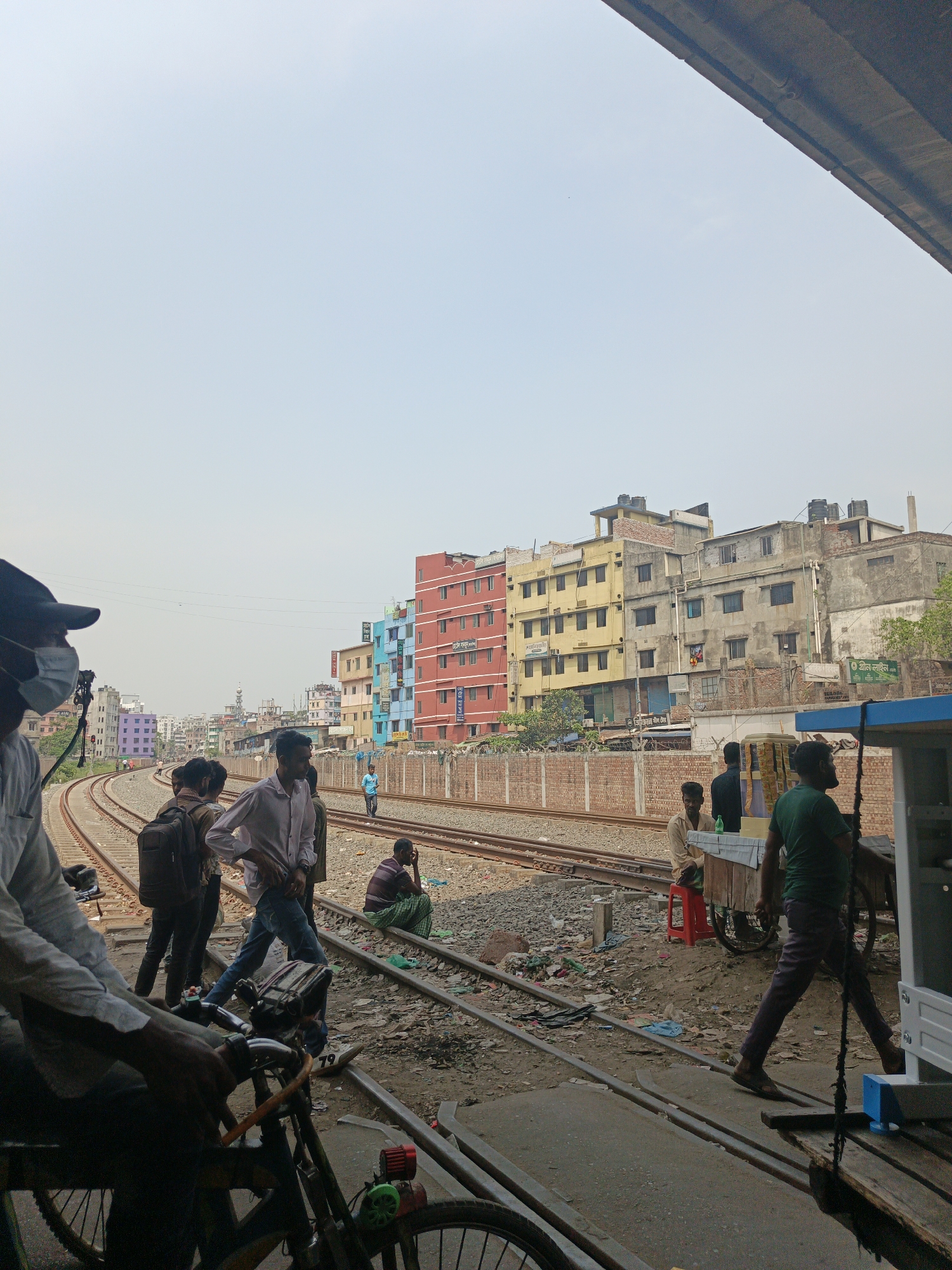 Morning commute activity observed near Dhaka railroad tracks