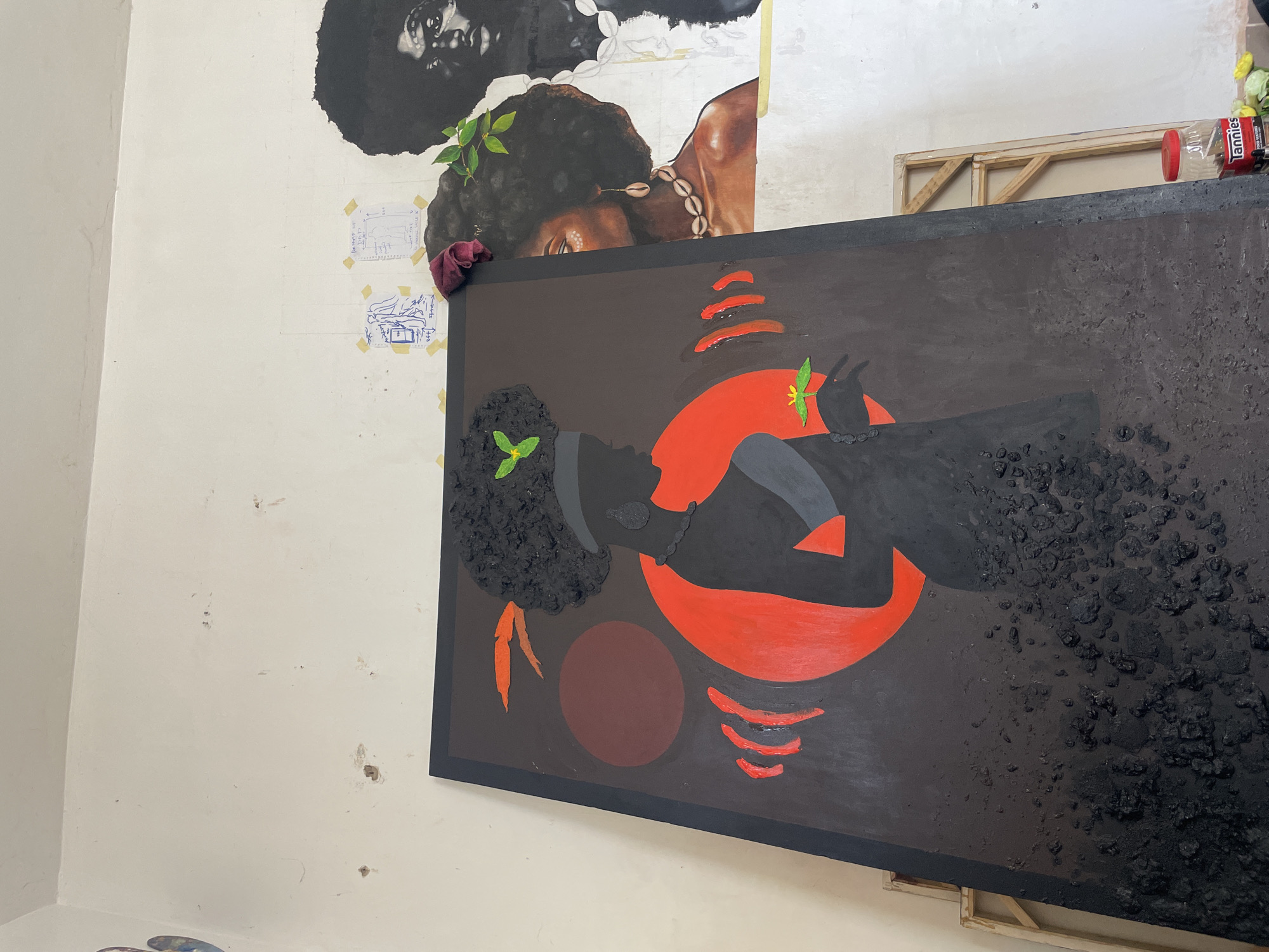 Artist creates portrait paintings in Ado studio workspace