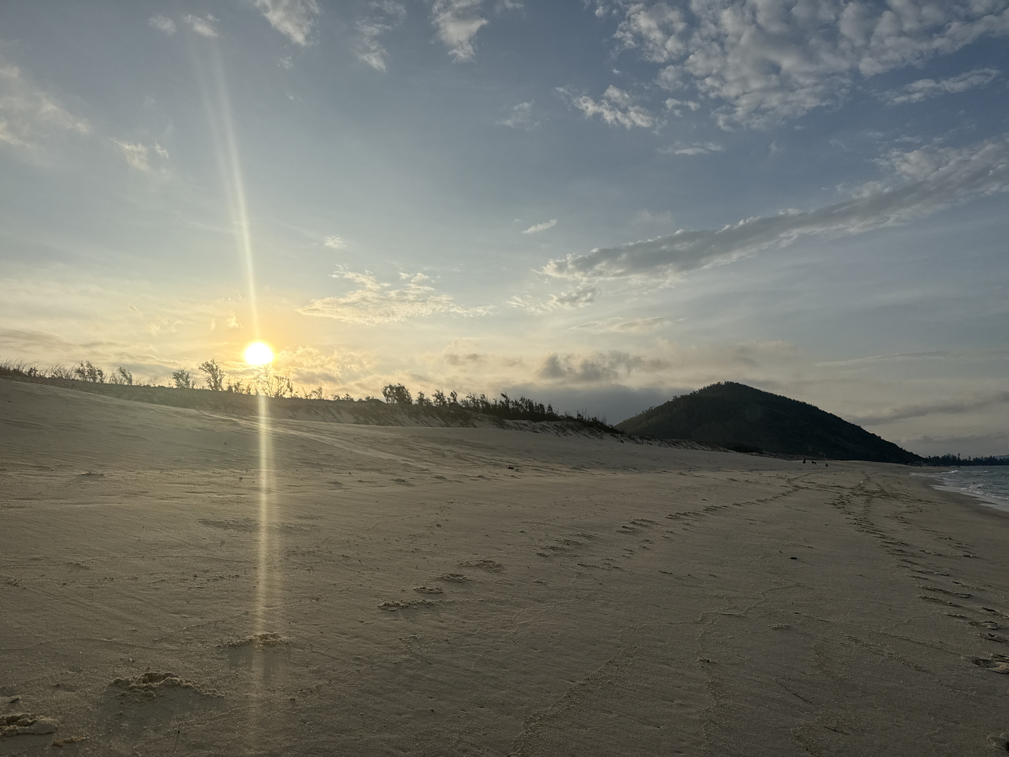 A coastal afternoon stretching from bright sun into dusk