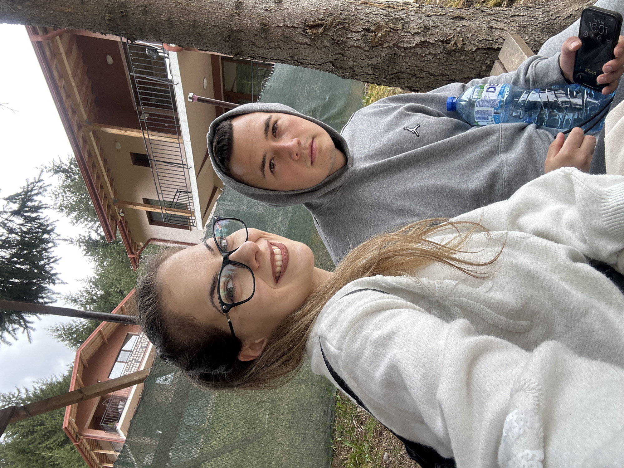 Two people relax in garden setting in Sarnitsa, Bulgaria
