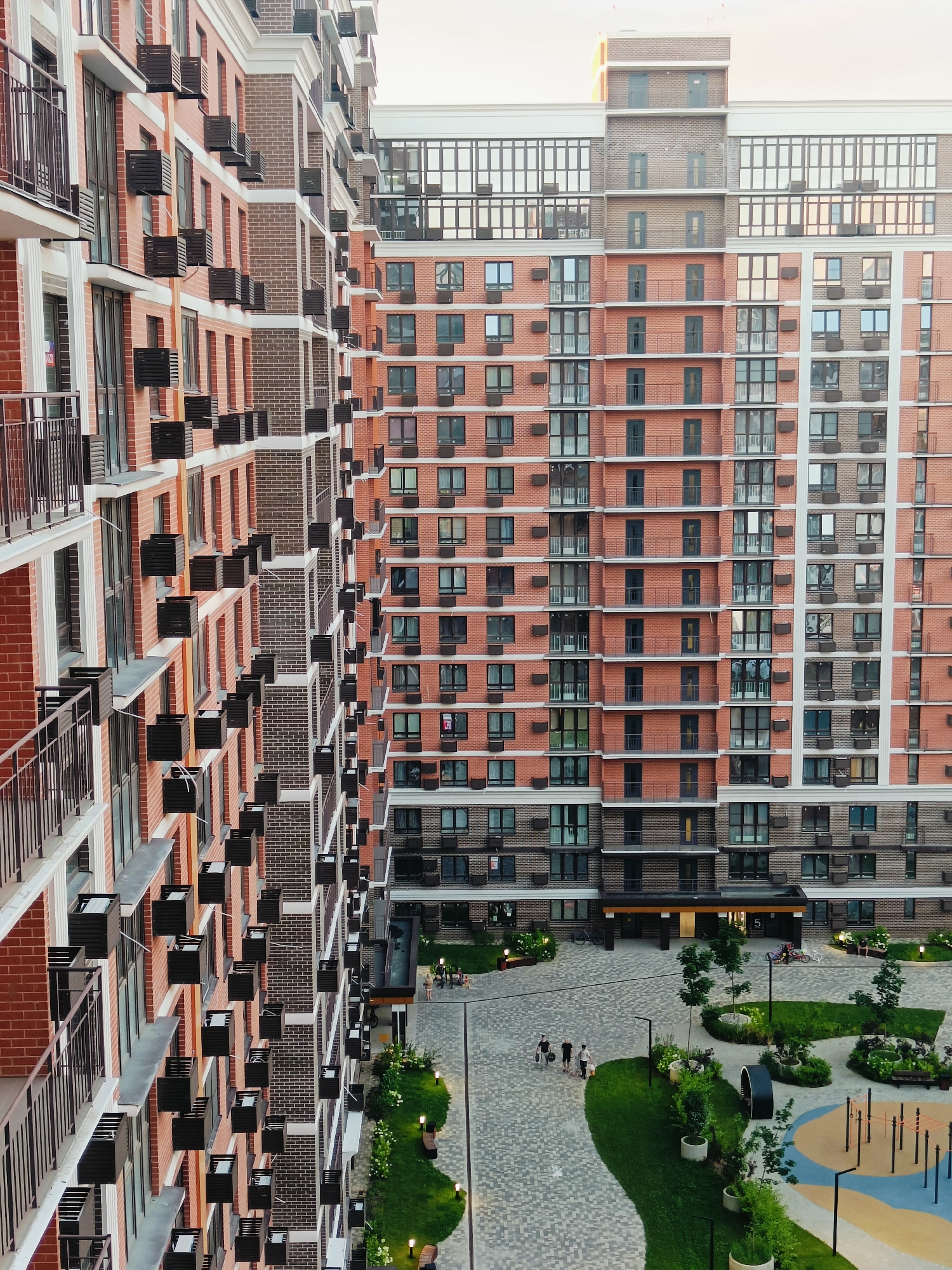 Red brick residential complex in Krasnodar, seen from multiple angles