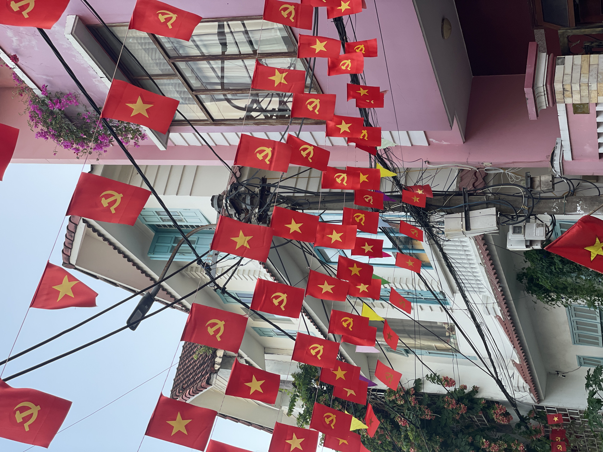 Vietnamese flags line streets in Đà Nẵng city scenes