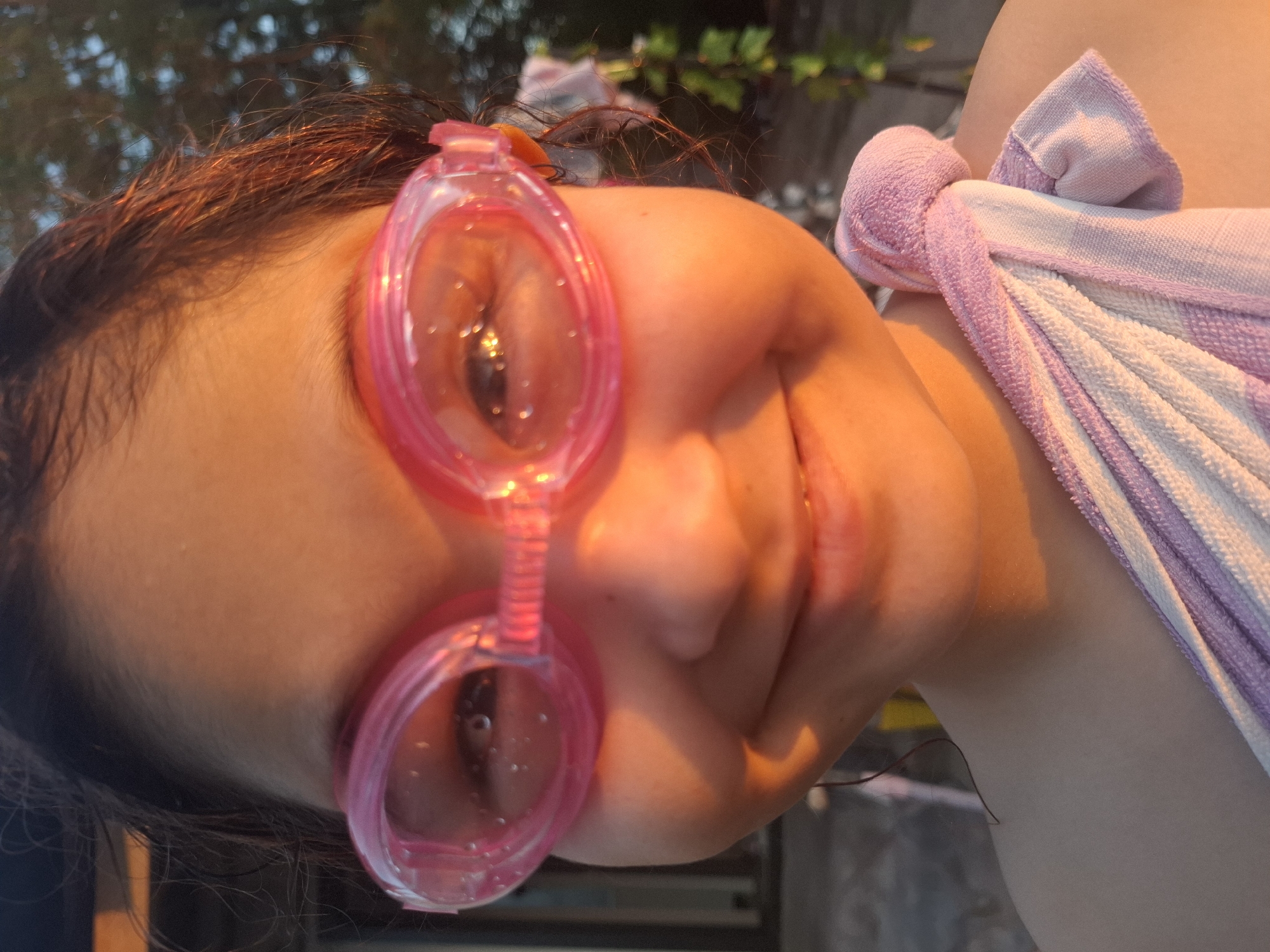 Backyard moments: golden hour, a puppy, and swim goggles
