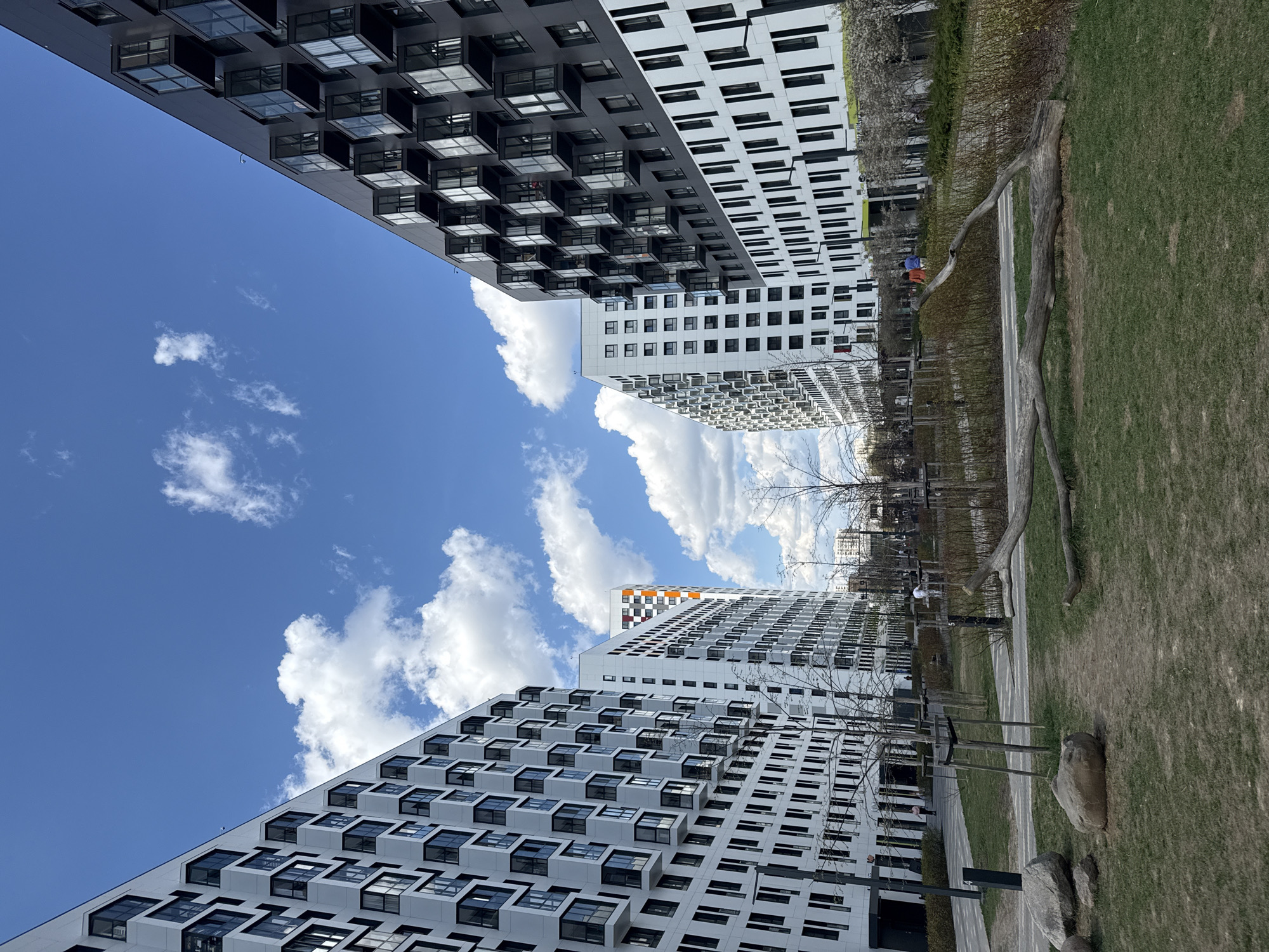 Upward view captured between modern Moscow residential towers