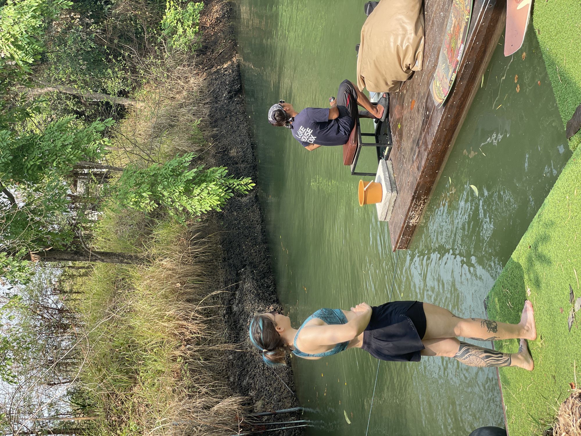 Woman in sportswear spotted near waterway in Thailand