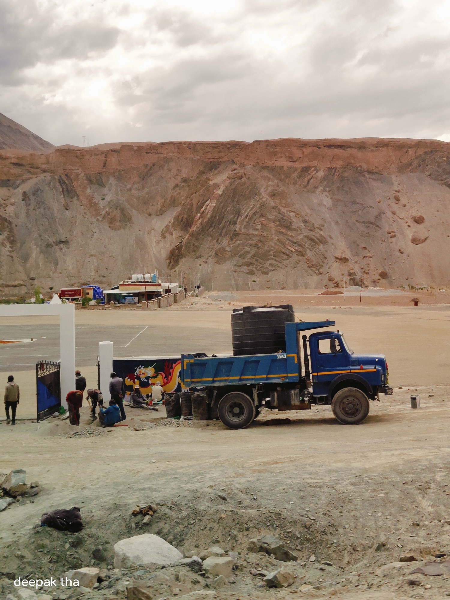 Water tank truck parked on a mountain dirt road in Chumkar