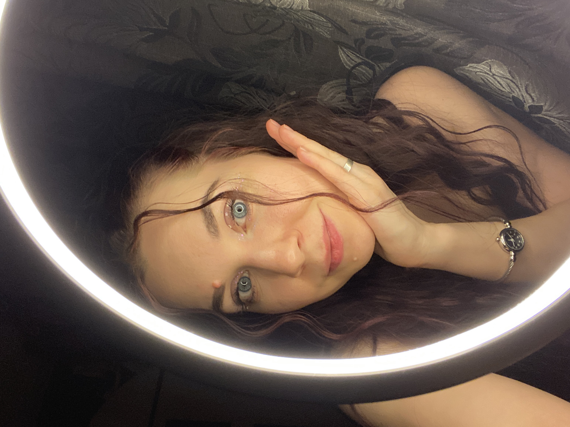 Woman poses for ring light photo session in Chaikovsky