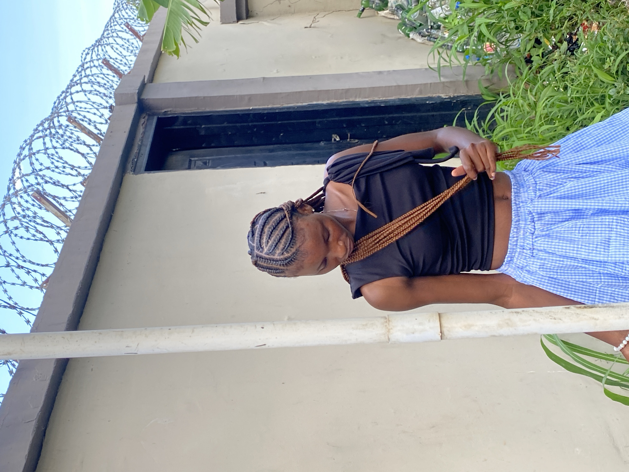 Everyday chores at an outdoor faucet in Gura Top, Nigeria