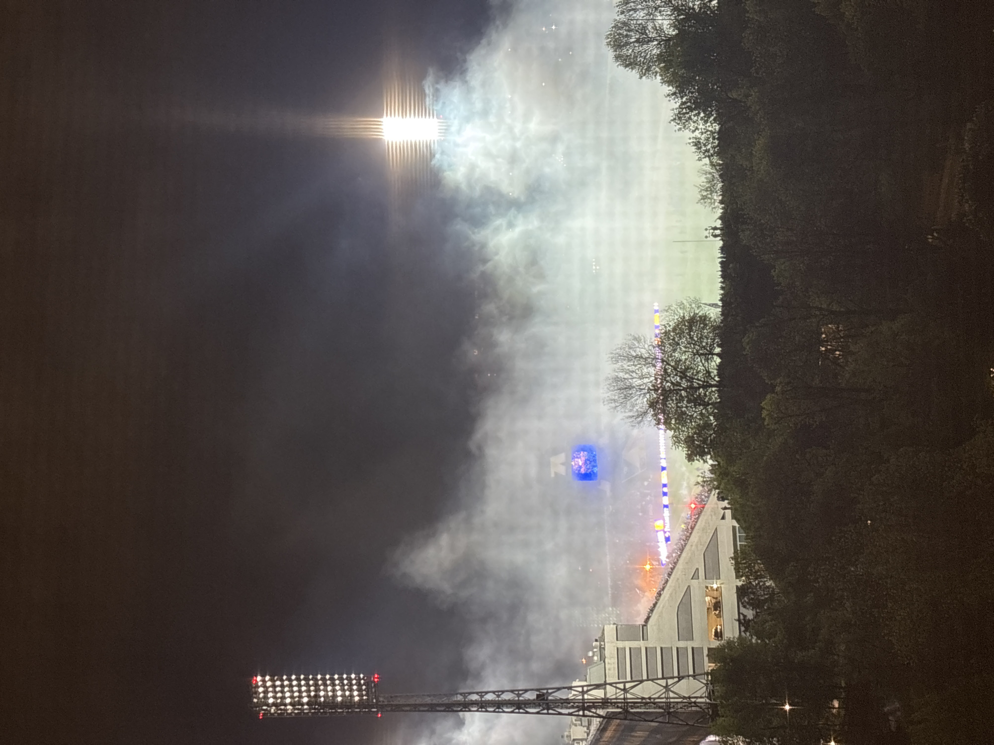 Smoke fills crowded stadium during nighttime sporting event