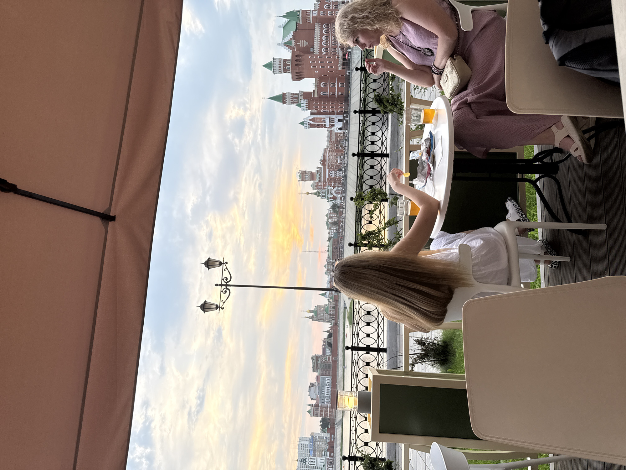Casual riverside dining along the Yoshkar-Ola embankment at dusk