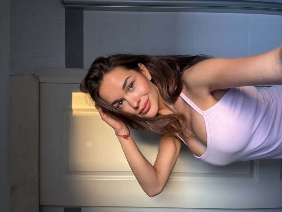 Woman photographed multiple times indoors in Tel Aviv afternoon