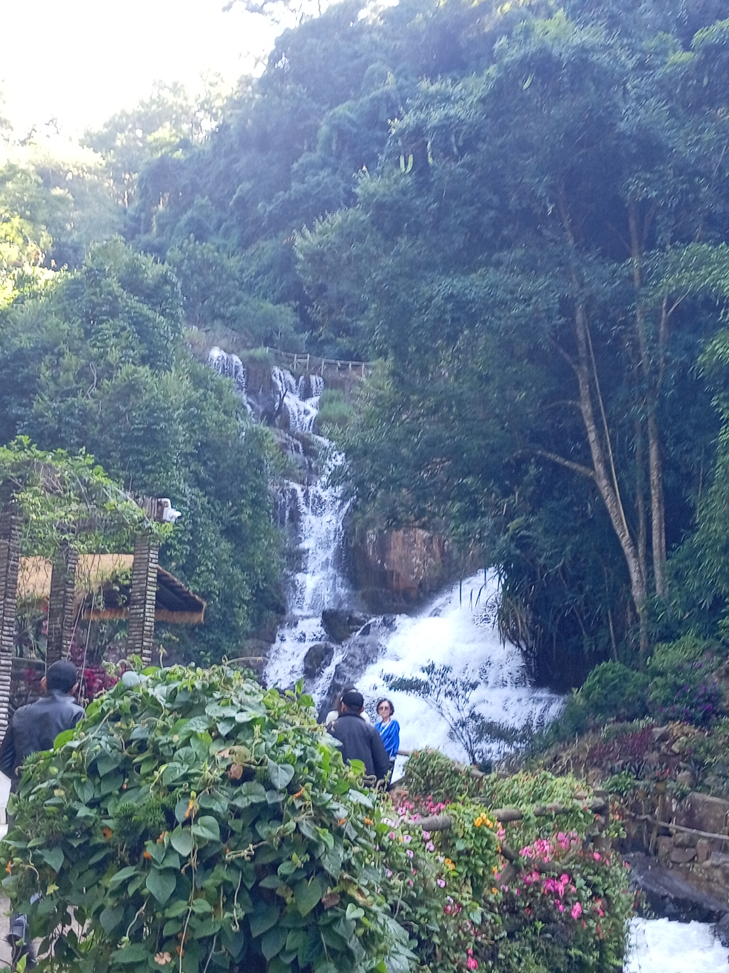 At the base of a Da Lat waterfall, August 2026