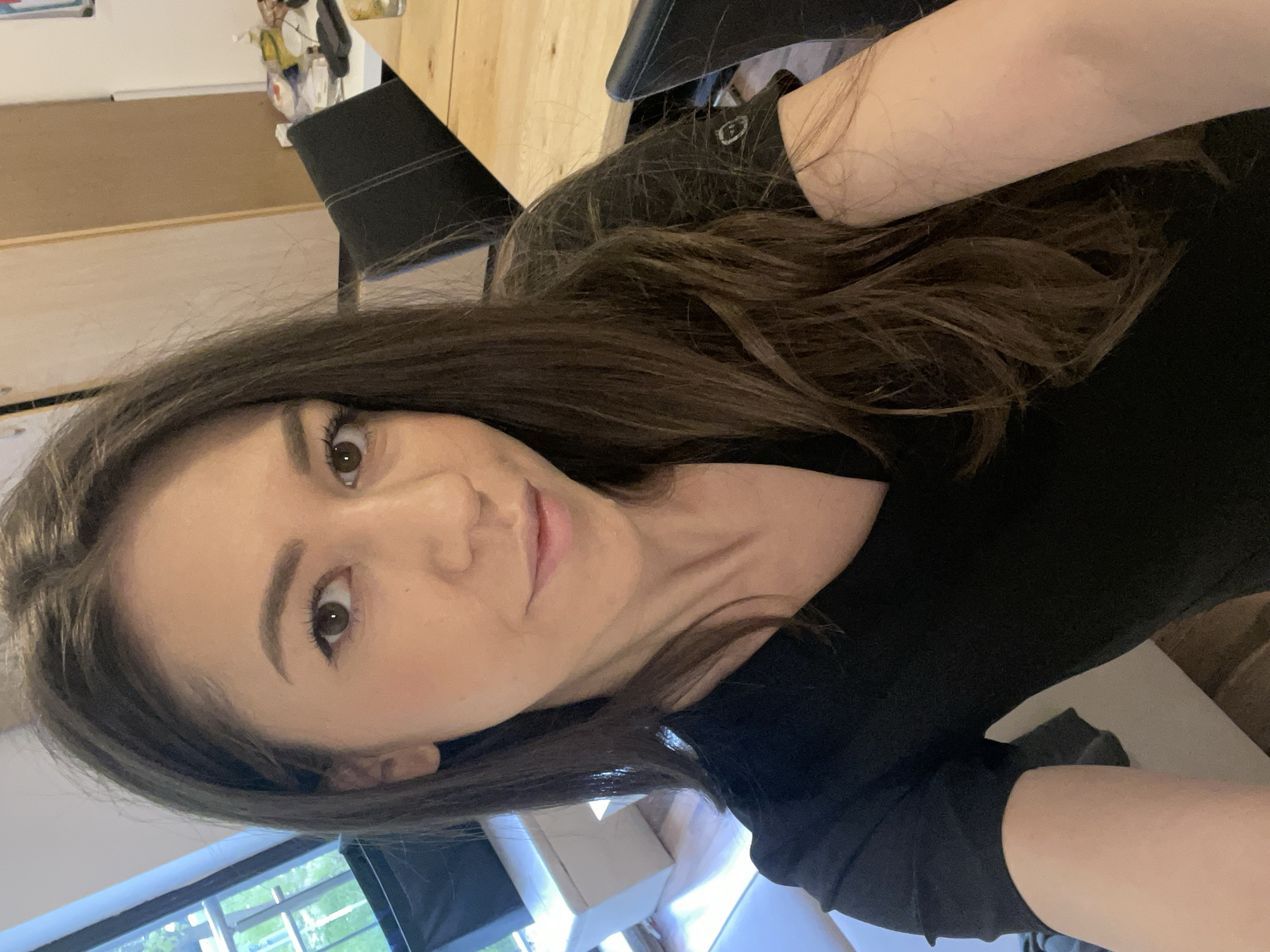 Woman takes early morning selfie in Sofia interior