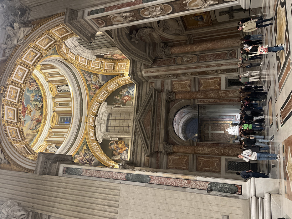 Tourist documents Vatican's St. Peter's Basilica during evening visit