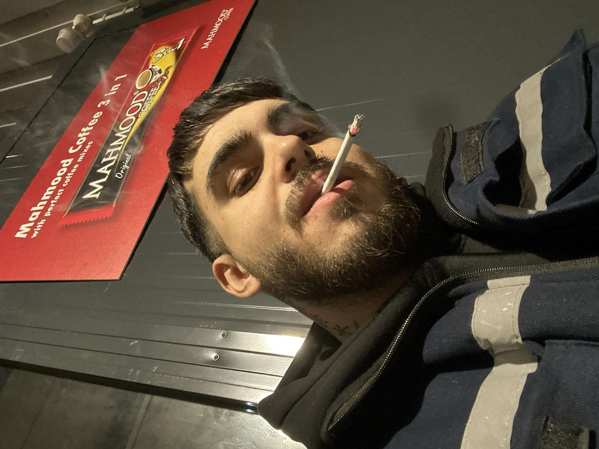 Man takes smoking selfie near coffee shop in Frankfurt