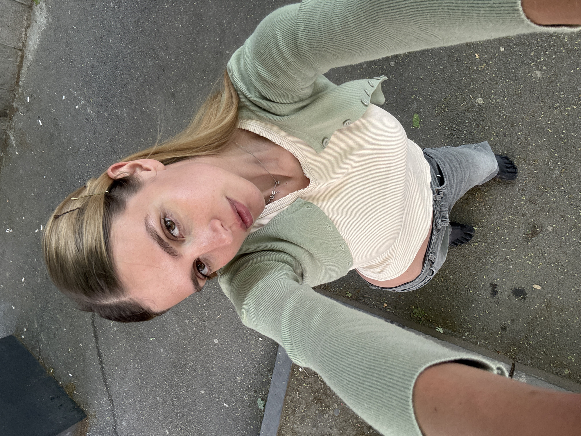 Woman photographed on Tbilisi street in casual outfit