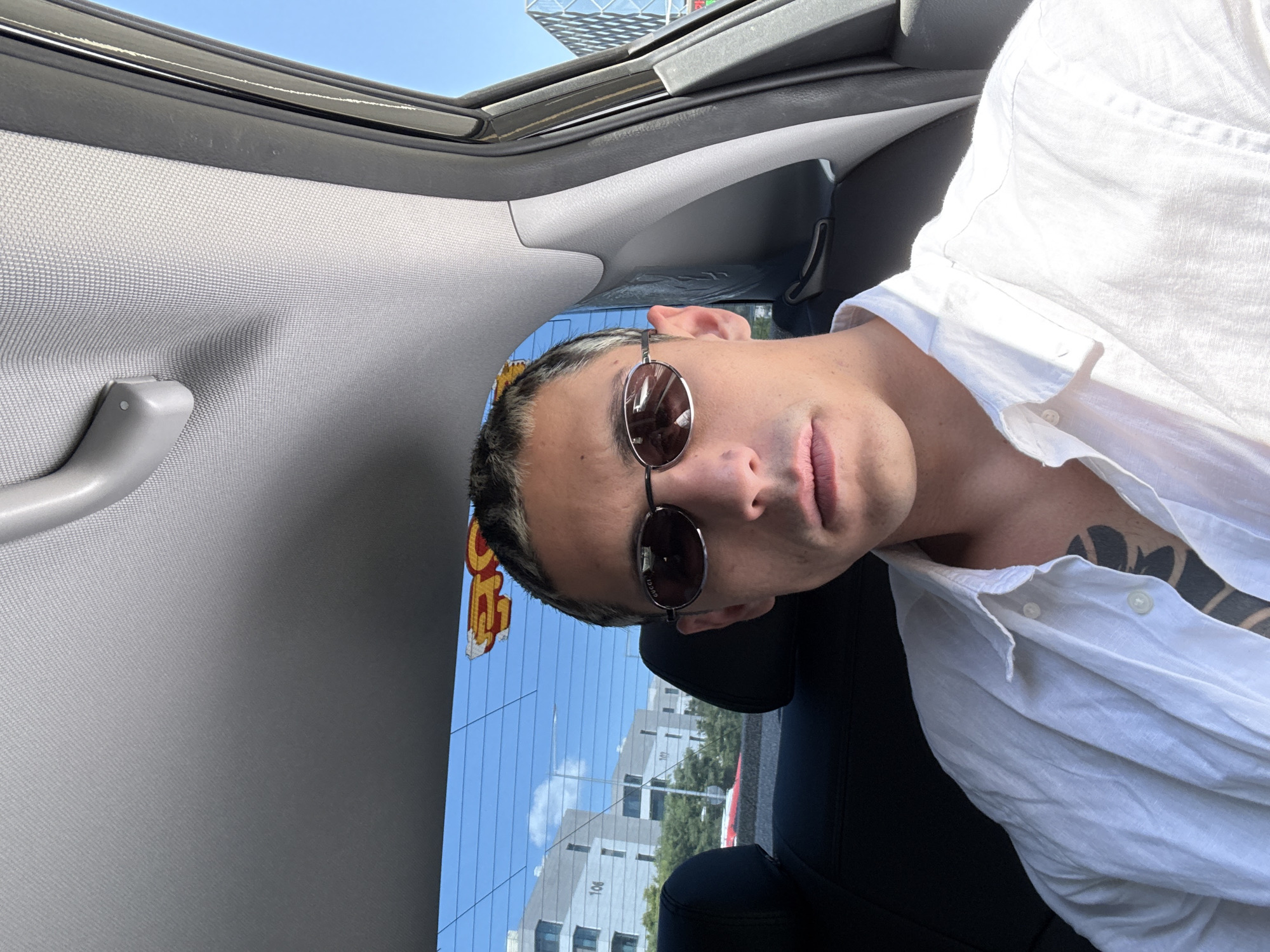 Man in sunglasses spotted in open-roof car in Seoul