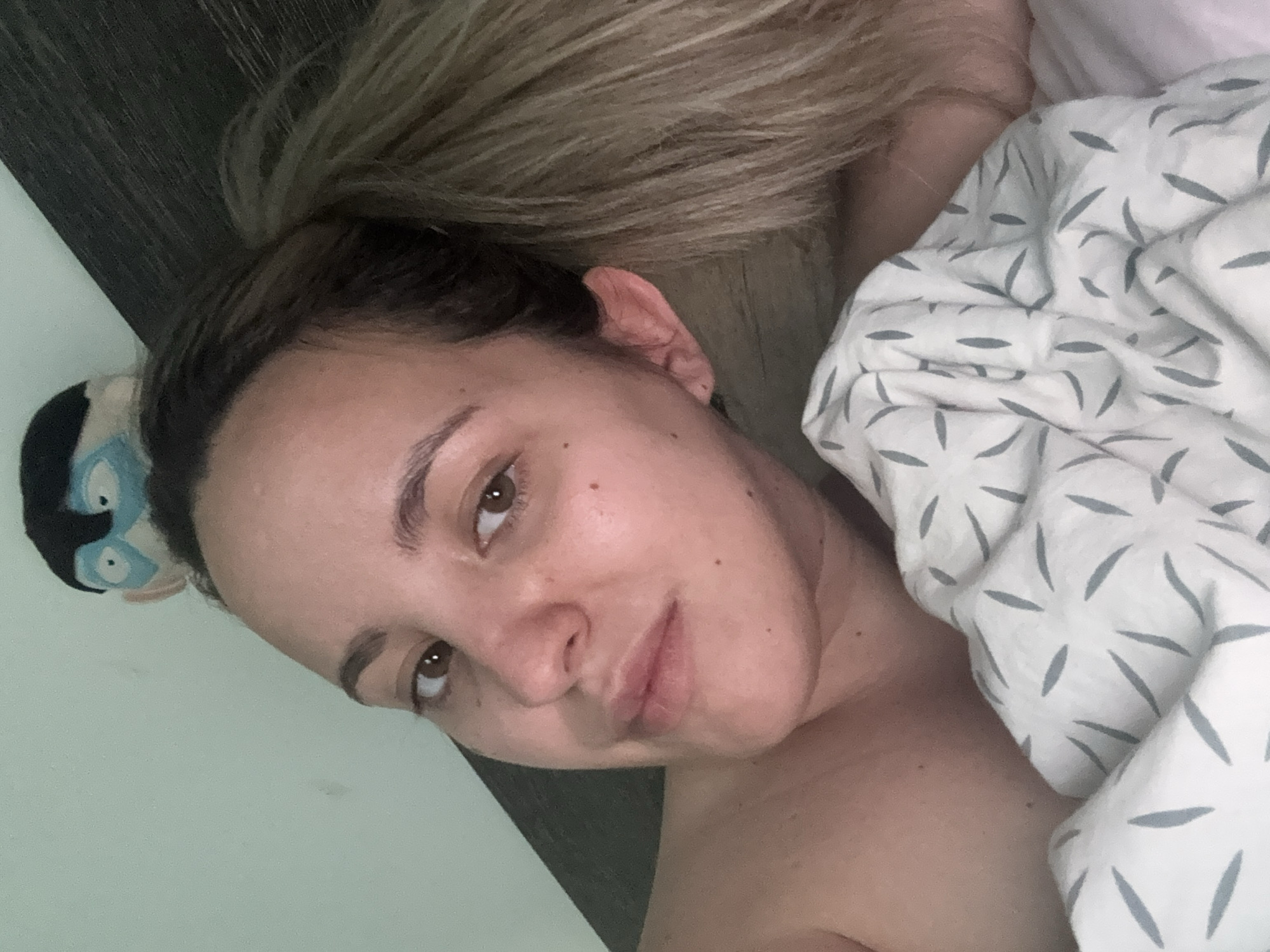 Woman photographed in intimate bedroom portrait in Sofia