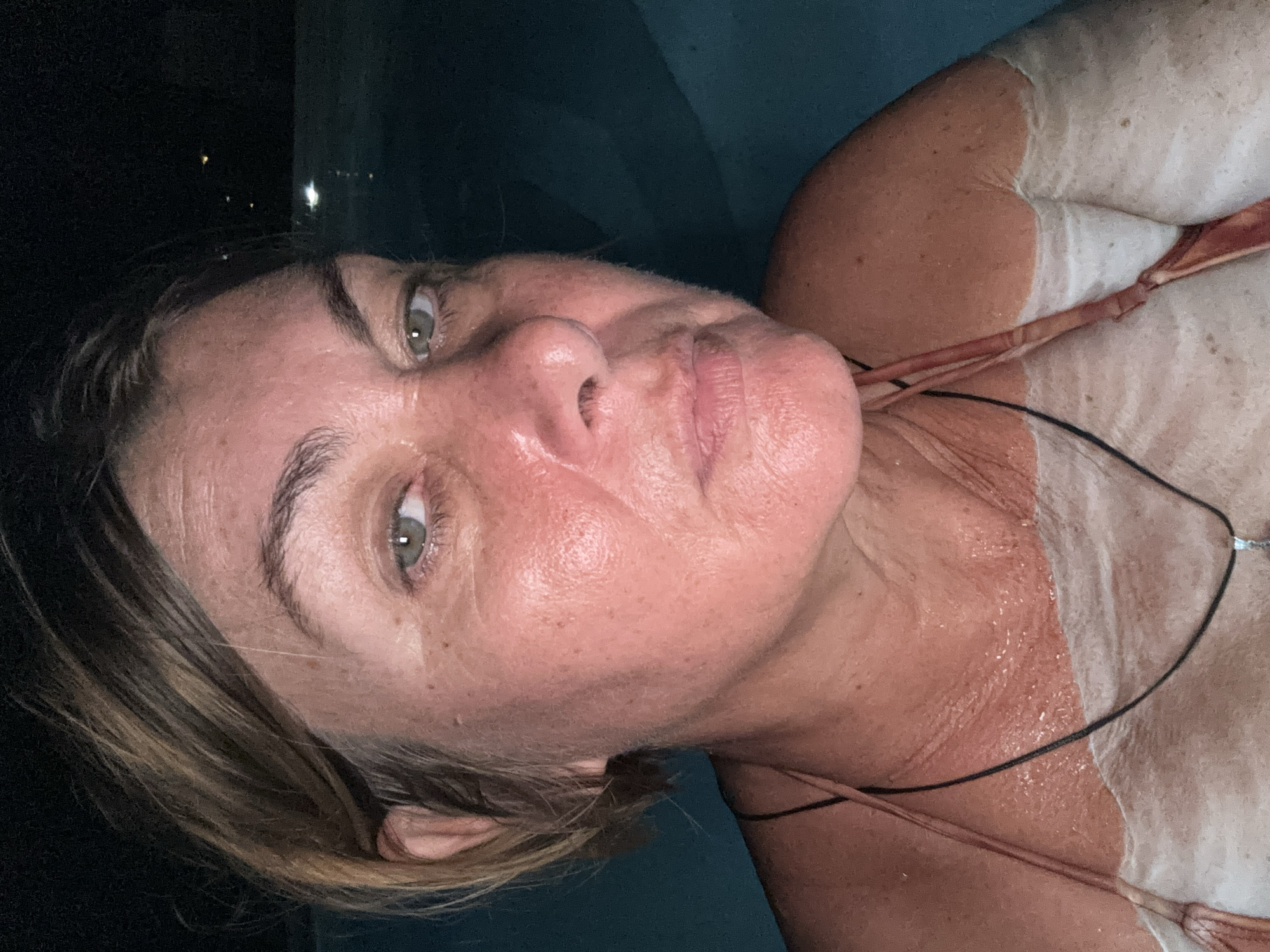 Woman swimming at night in Ban Bang Rak pool