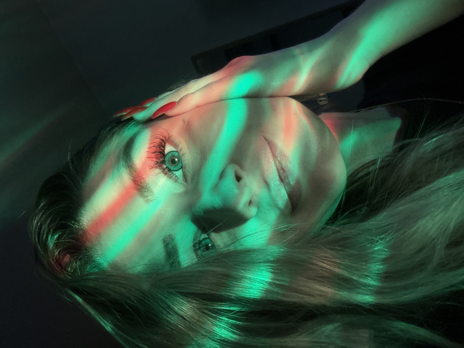 Woman documents evening routine with atmospheric lighting in Reutov