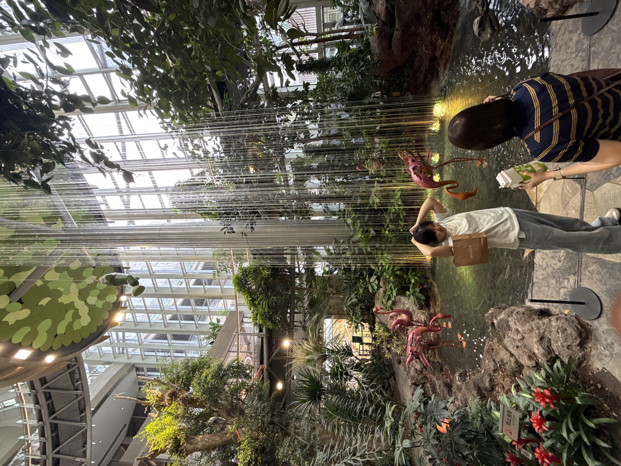 Visitors explore themed shopping mall attractions in Liangjiang, China