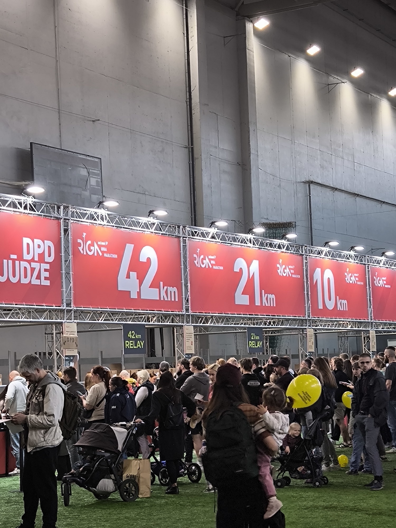 Indoor crowd gathers at Riga venue during marathon event