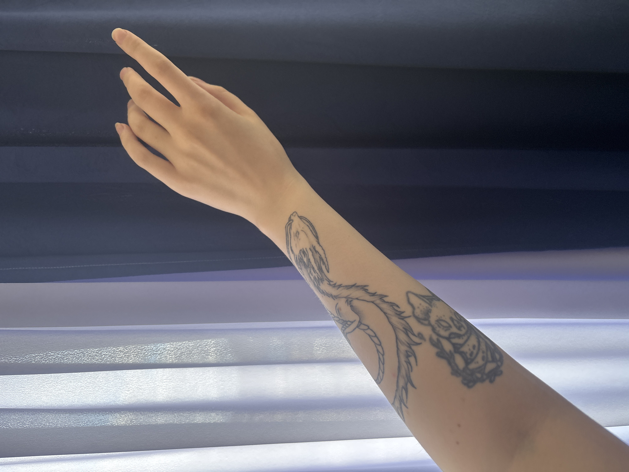 Casual moments captured in Russian town: tattoo, traffic sign, bulletin board