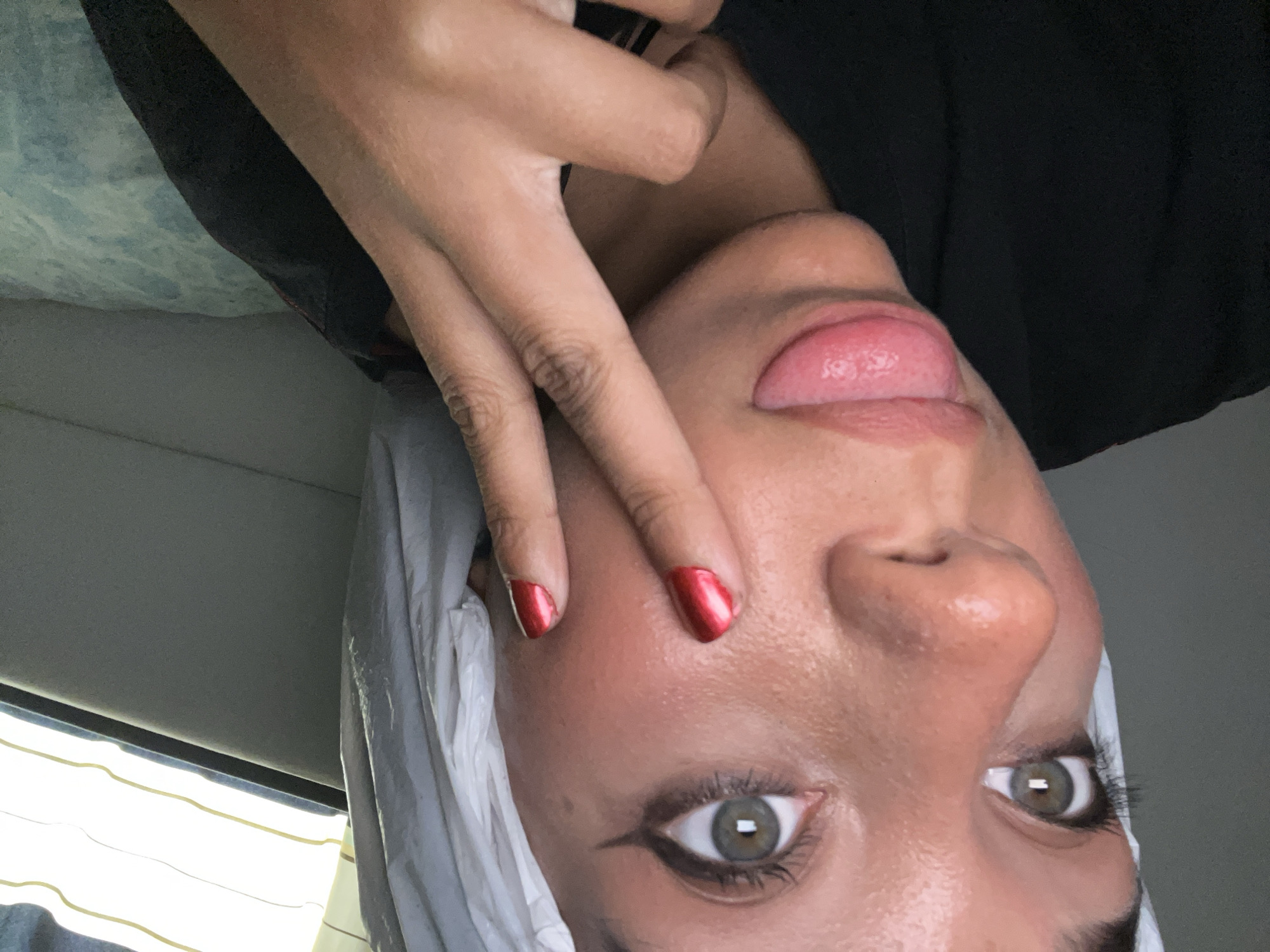 Young woman documents evening selfie session in Pampatar, Venezuela