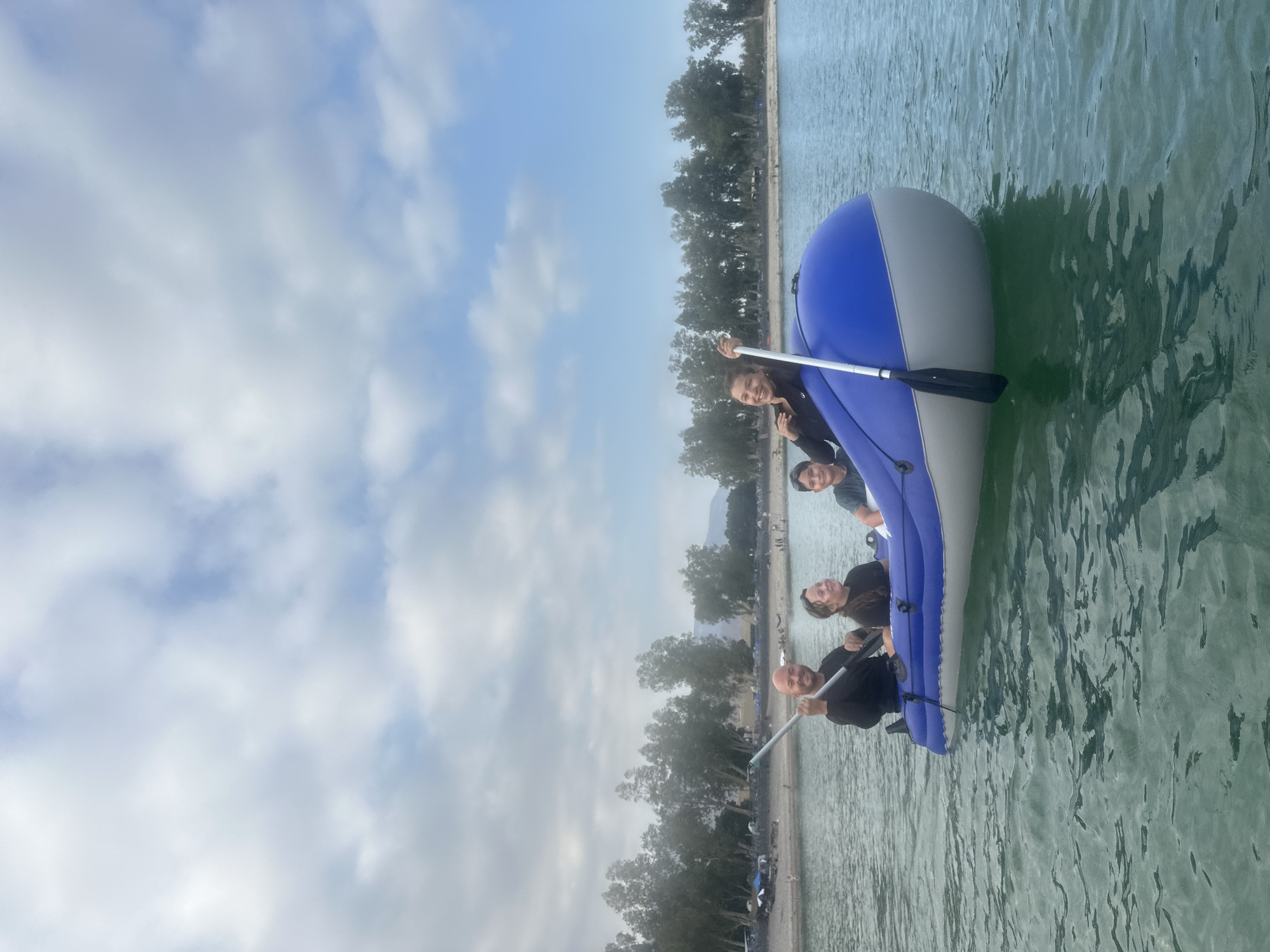 Family morning on the Sea of Galilee with paddleboards and a dog