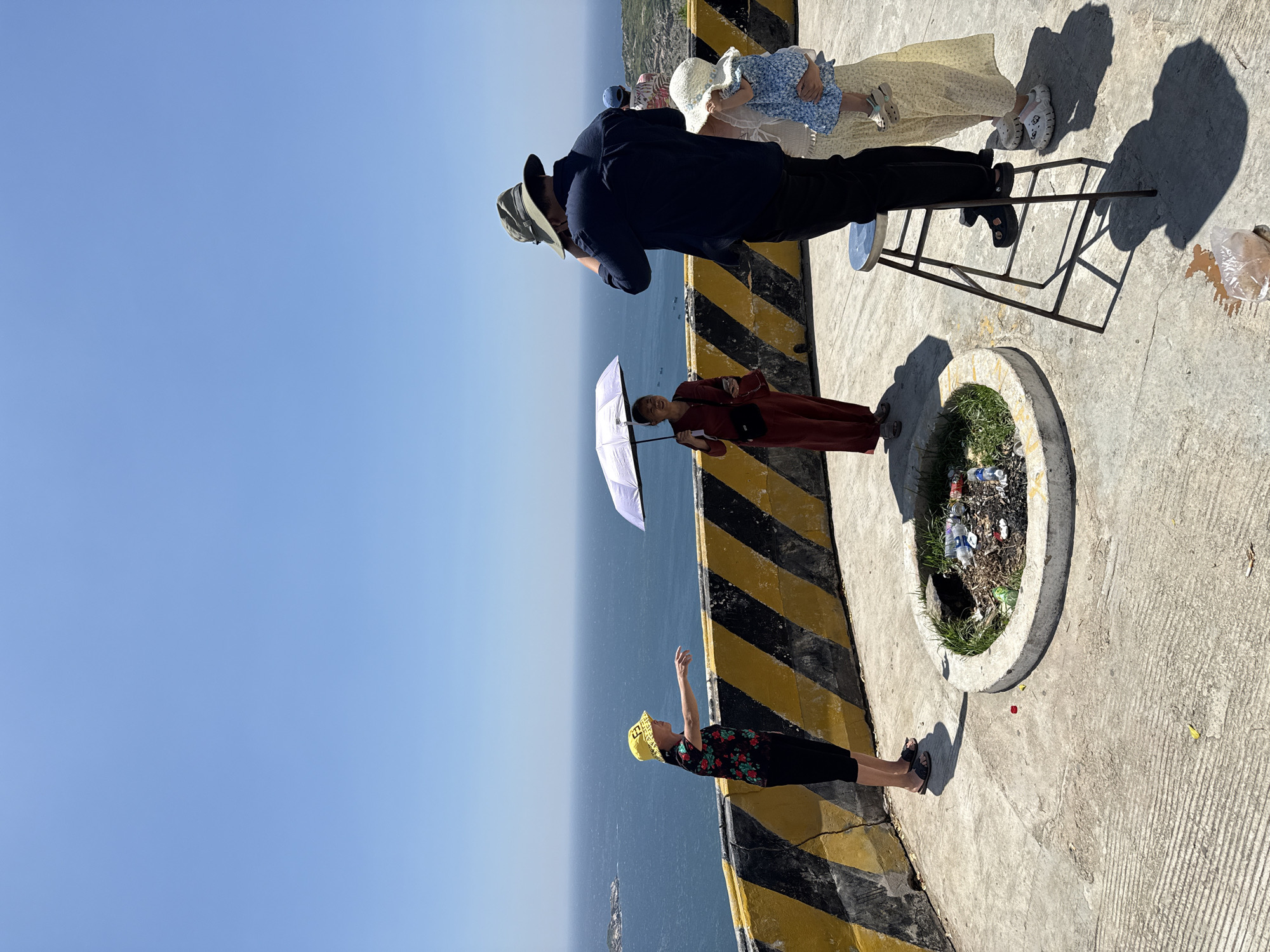 Family visits coastal overlook in Vinh Hai, Vietnam