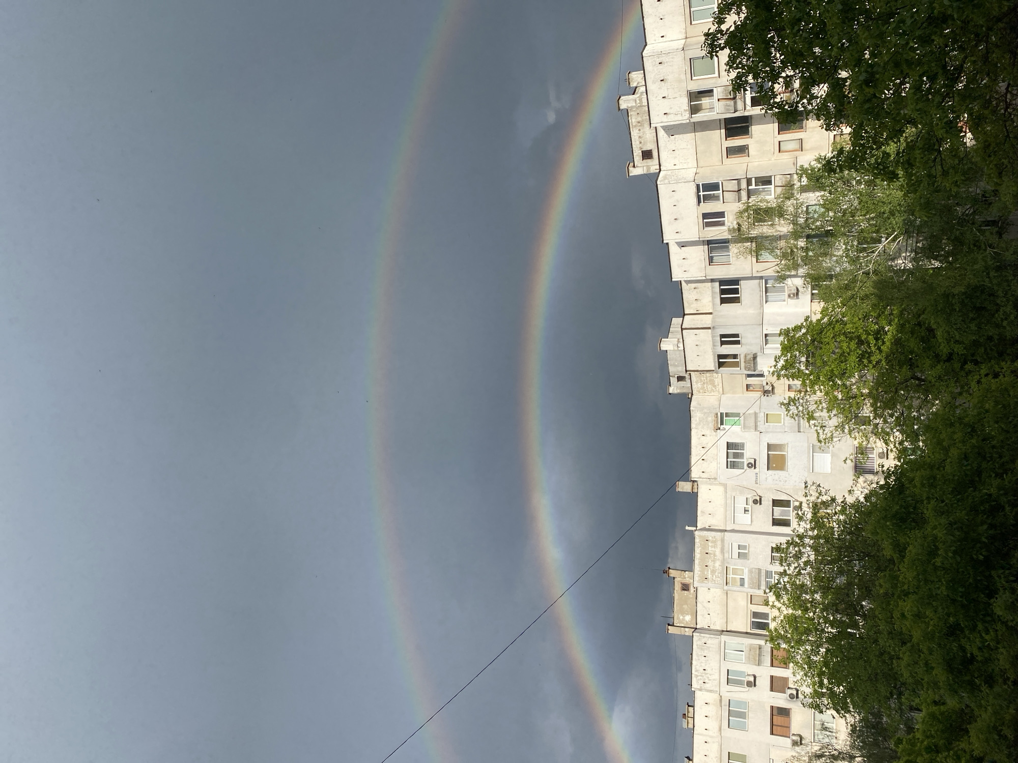 Double rainbow appears over Pleven apartment buildings after storm