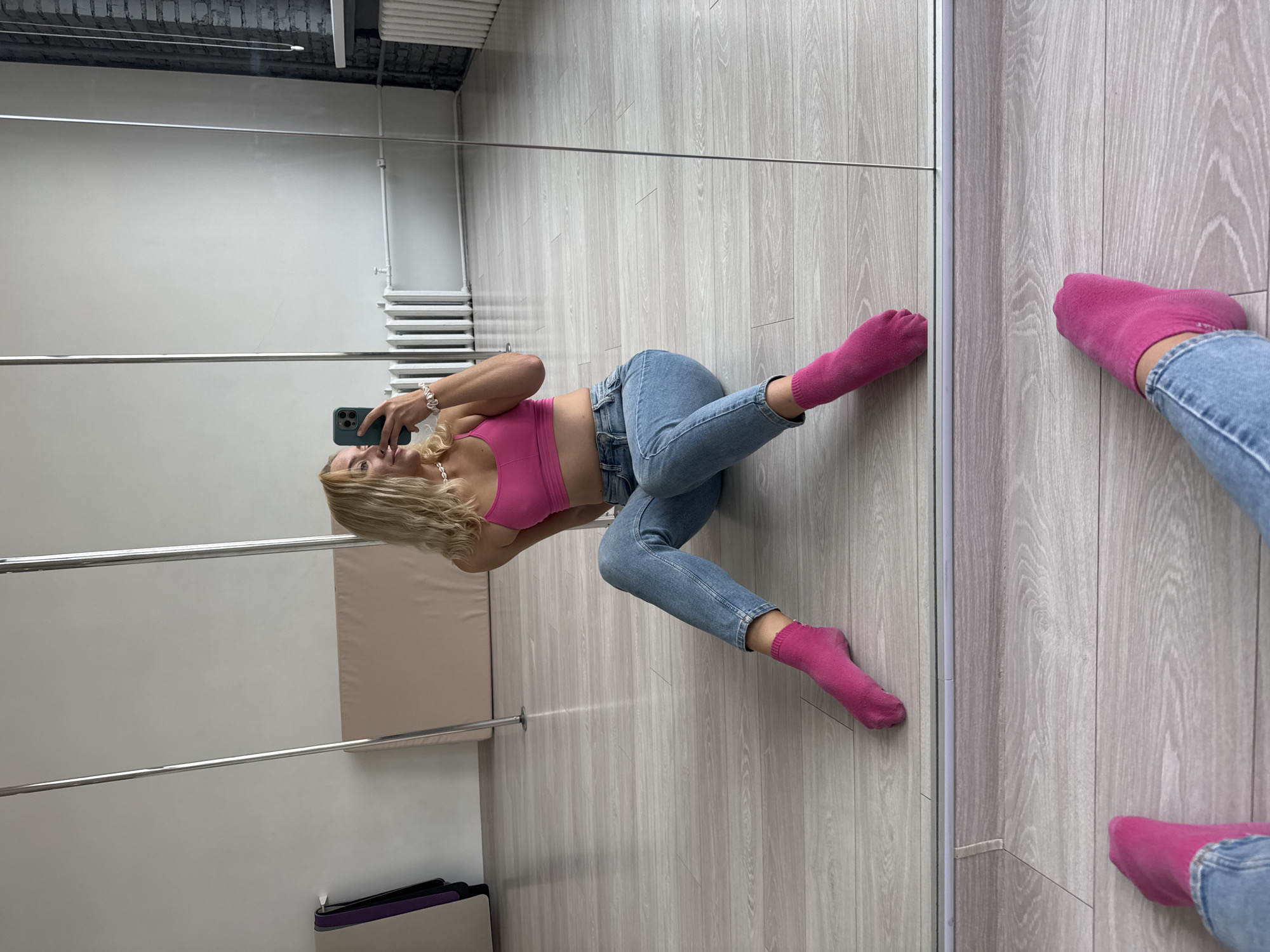 Woman practices pole dancing, takes selfies at Minsk studio