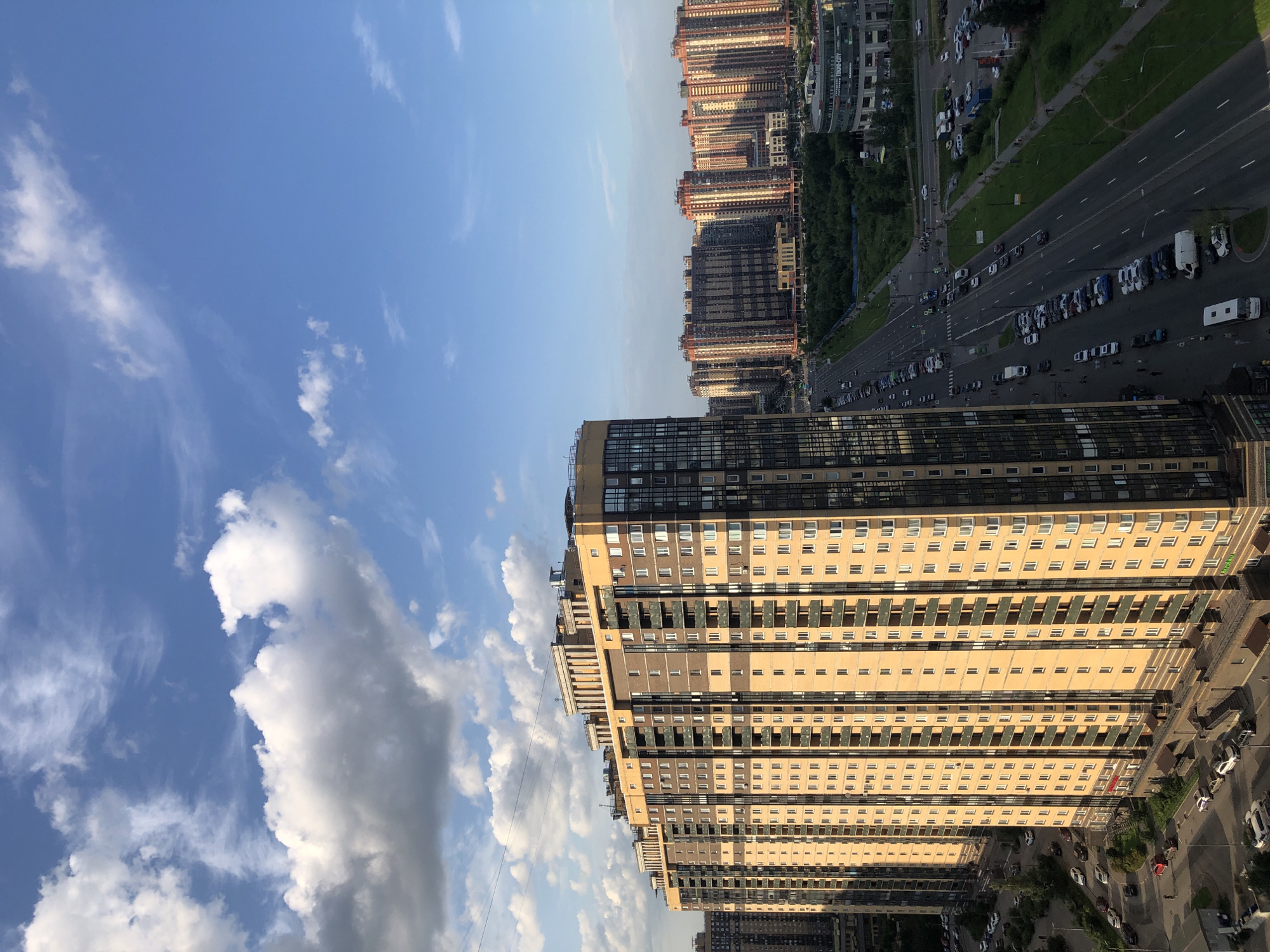Drone survey of a dense city: towers, roads, and industrial edges