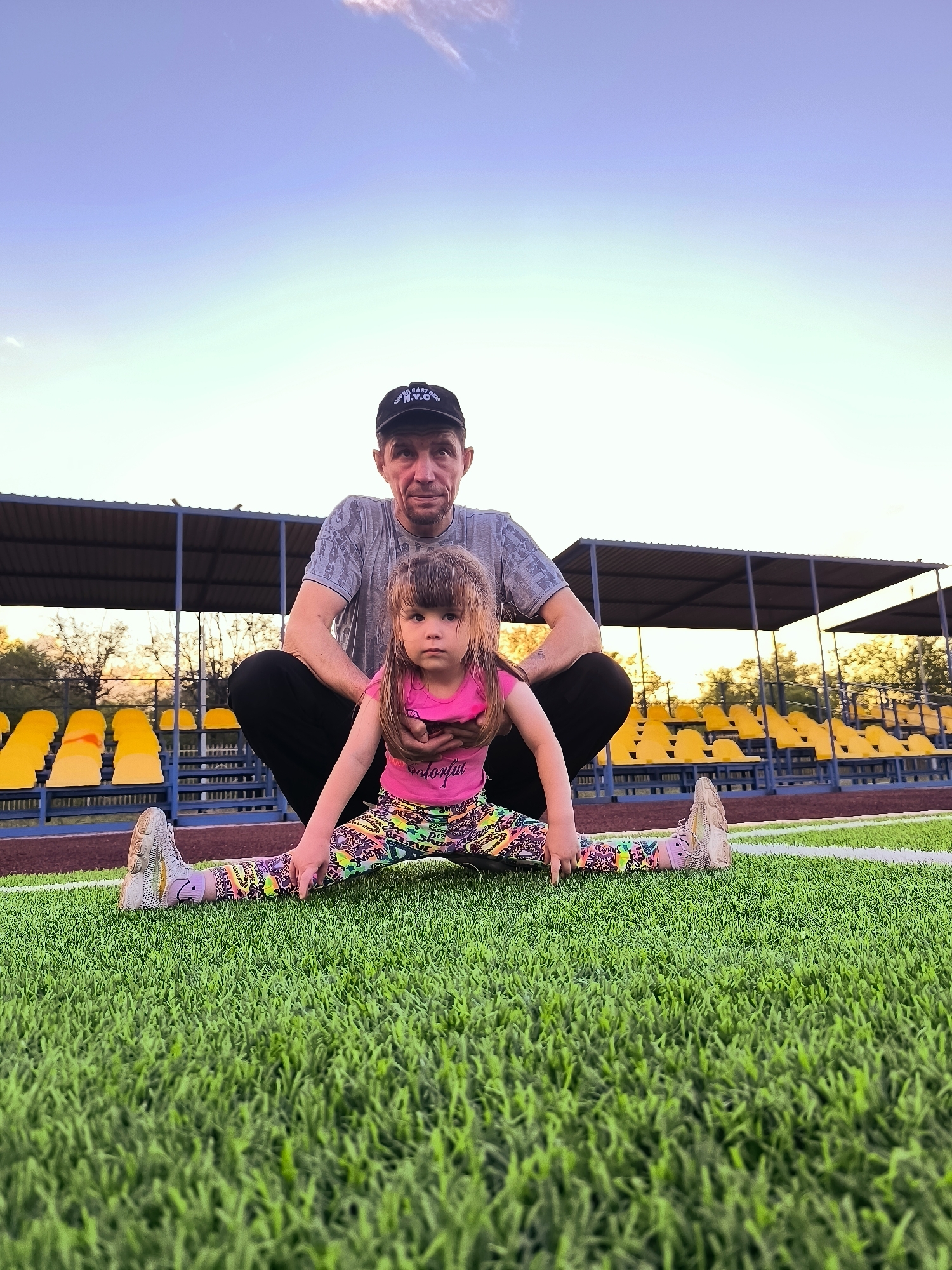 Family afternoon at Qarağandı stadium with exercises and sunset