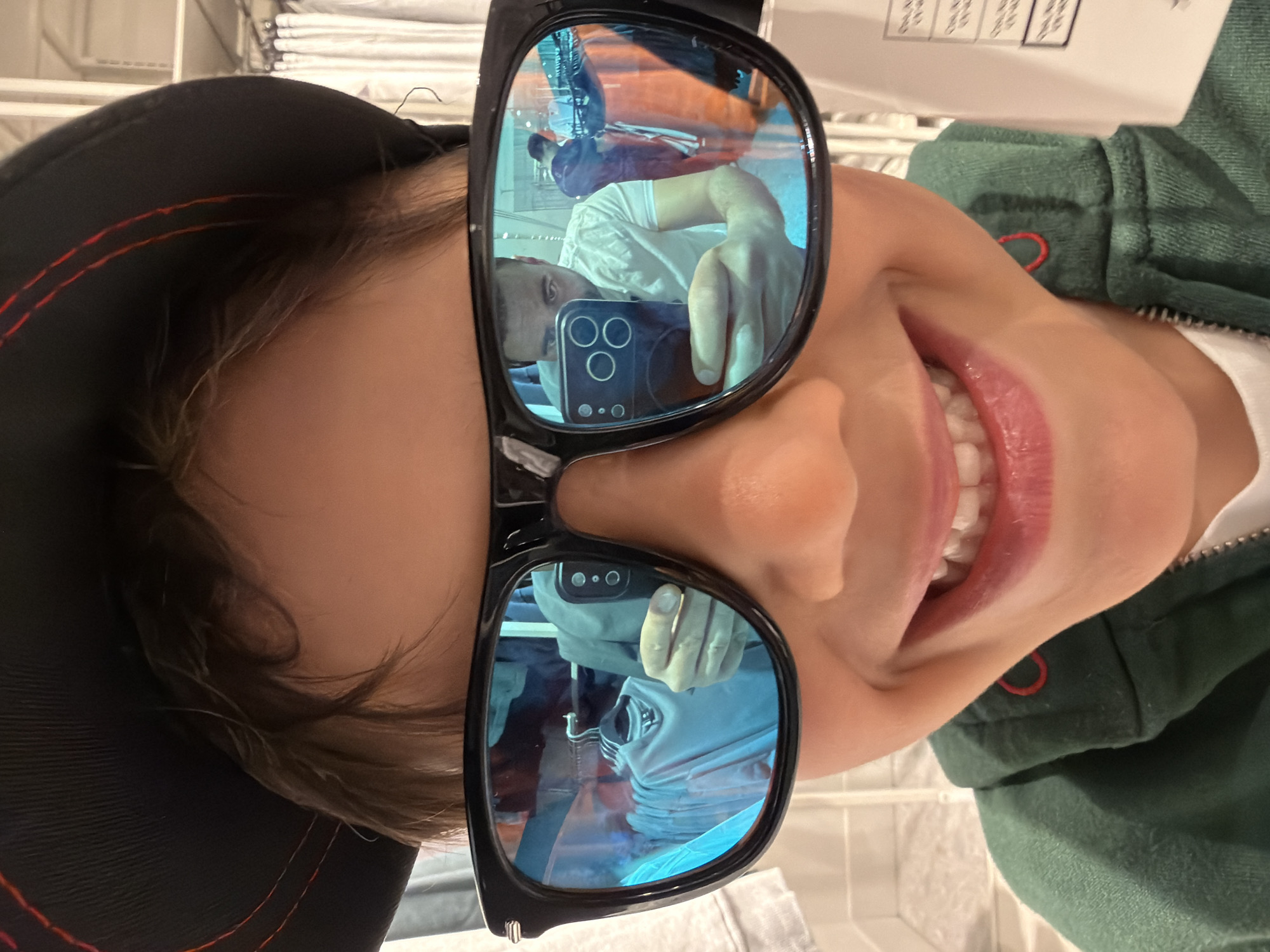 Family visits Hamleys toy store in London, views dinosaur display