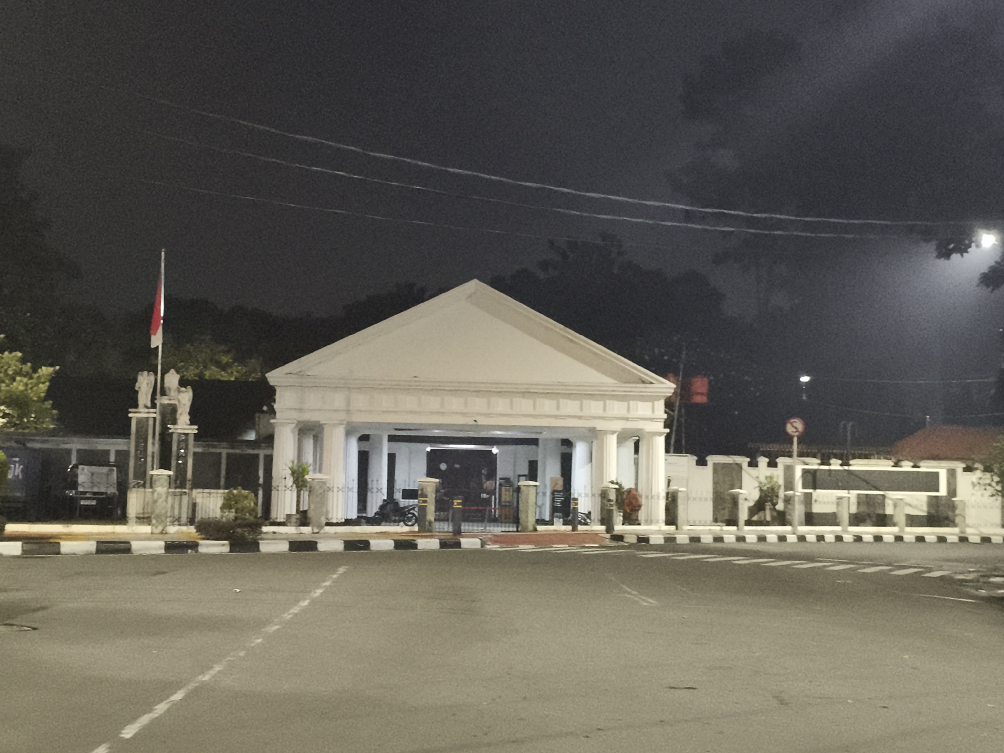 Classical white building documented at night in Central Jakarta