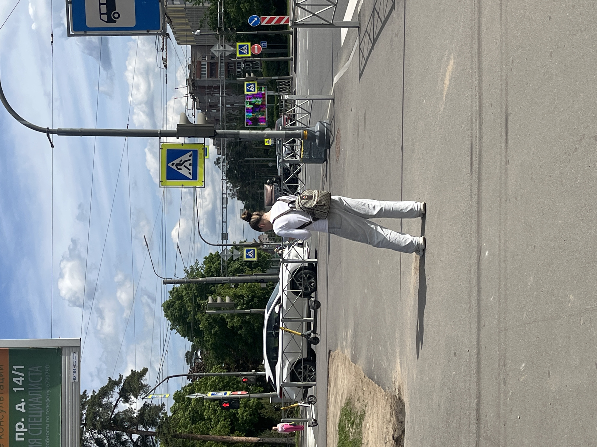 Woman spotted standing roadside in Saint Petersburg street scene