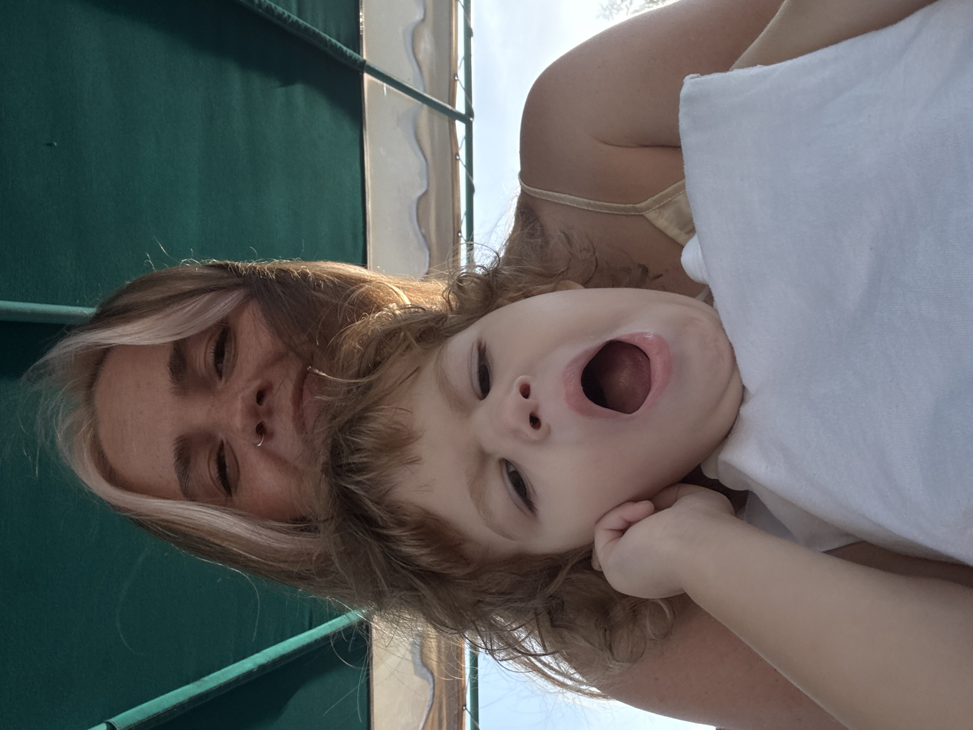 Mother and child capture moments during Thailand waterfront visit