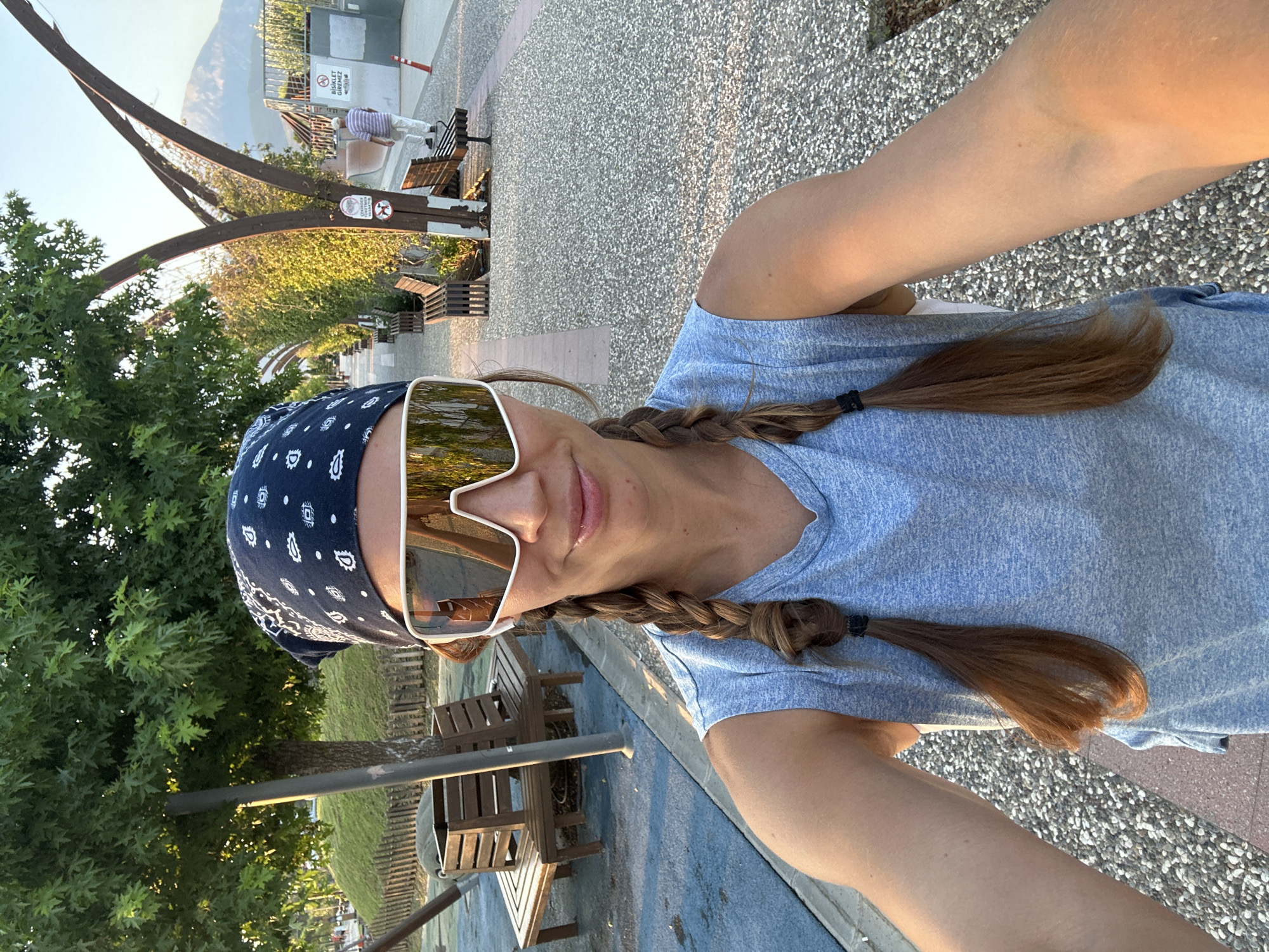 Selfie moment at a Fethiye park, blue bandana and white shades